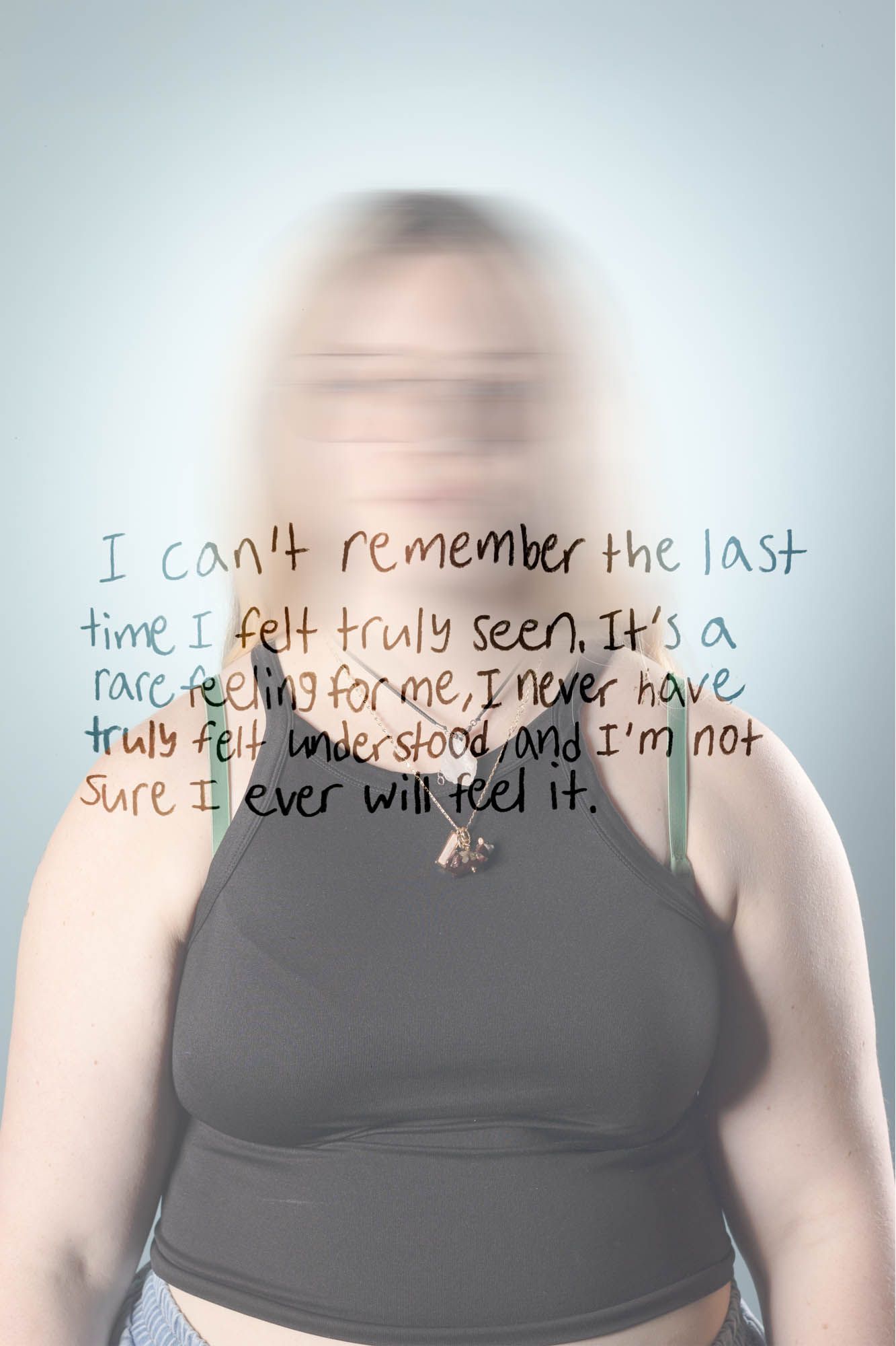 Blurred portrait of a blonde woman with handwritten text about never feeling truly seen or understood.