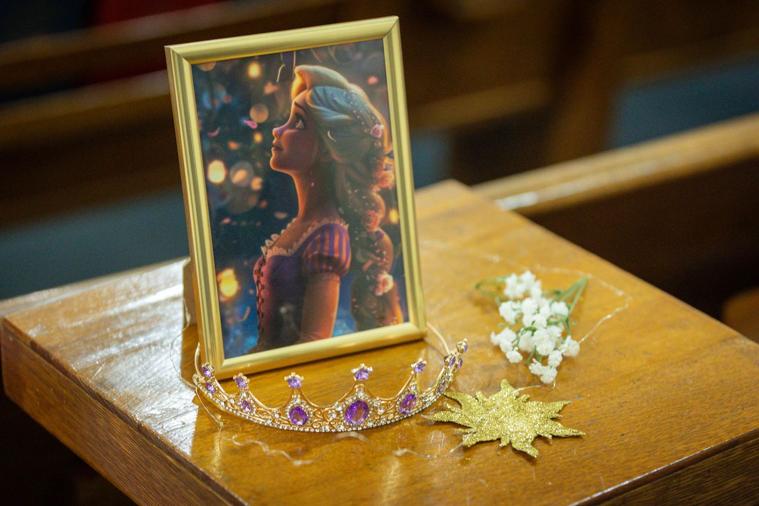 Framed Rapunzel artwork with purple tiara and floral decorations for a Tangled-themed Quinceañera.