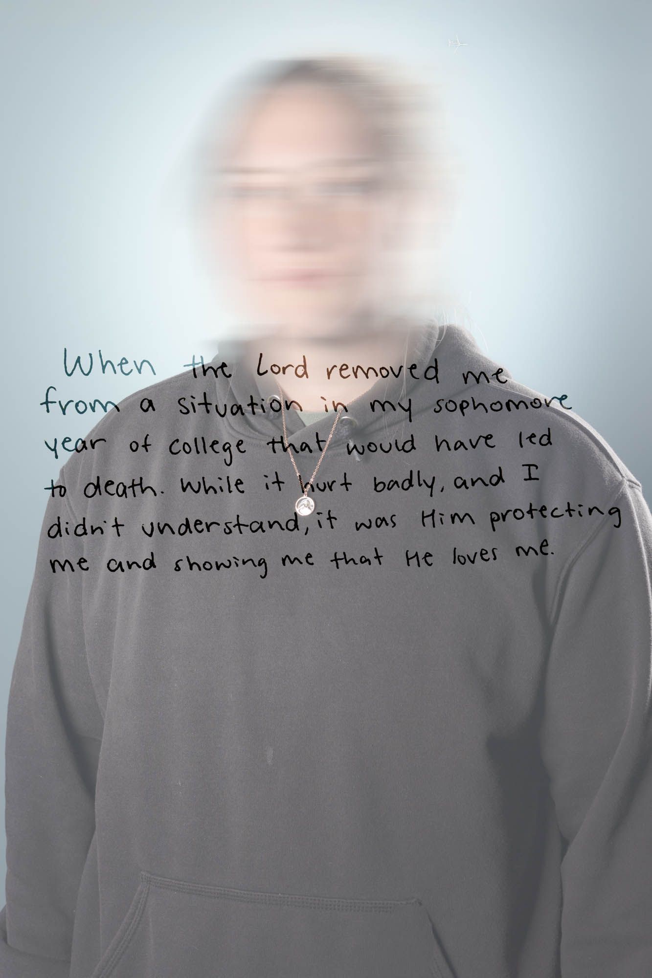 Blurred portrait of a young person with handwritten text about God protecting them from a dangerous situation.