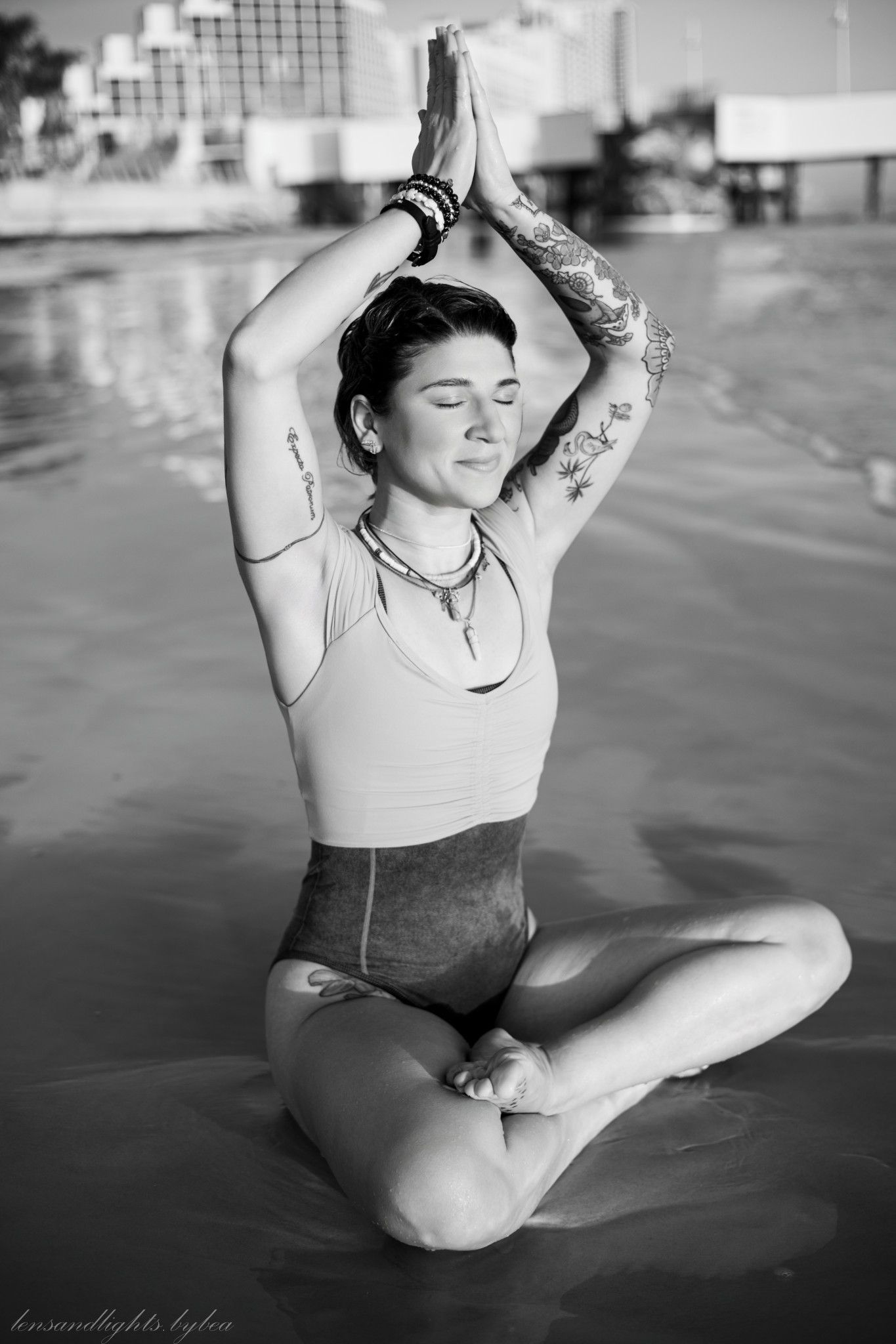 Black and white portraits of a dancer in graceful poses on the floor.