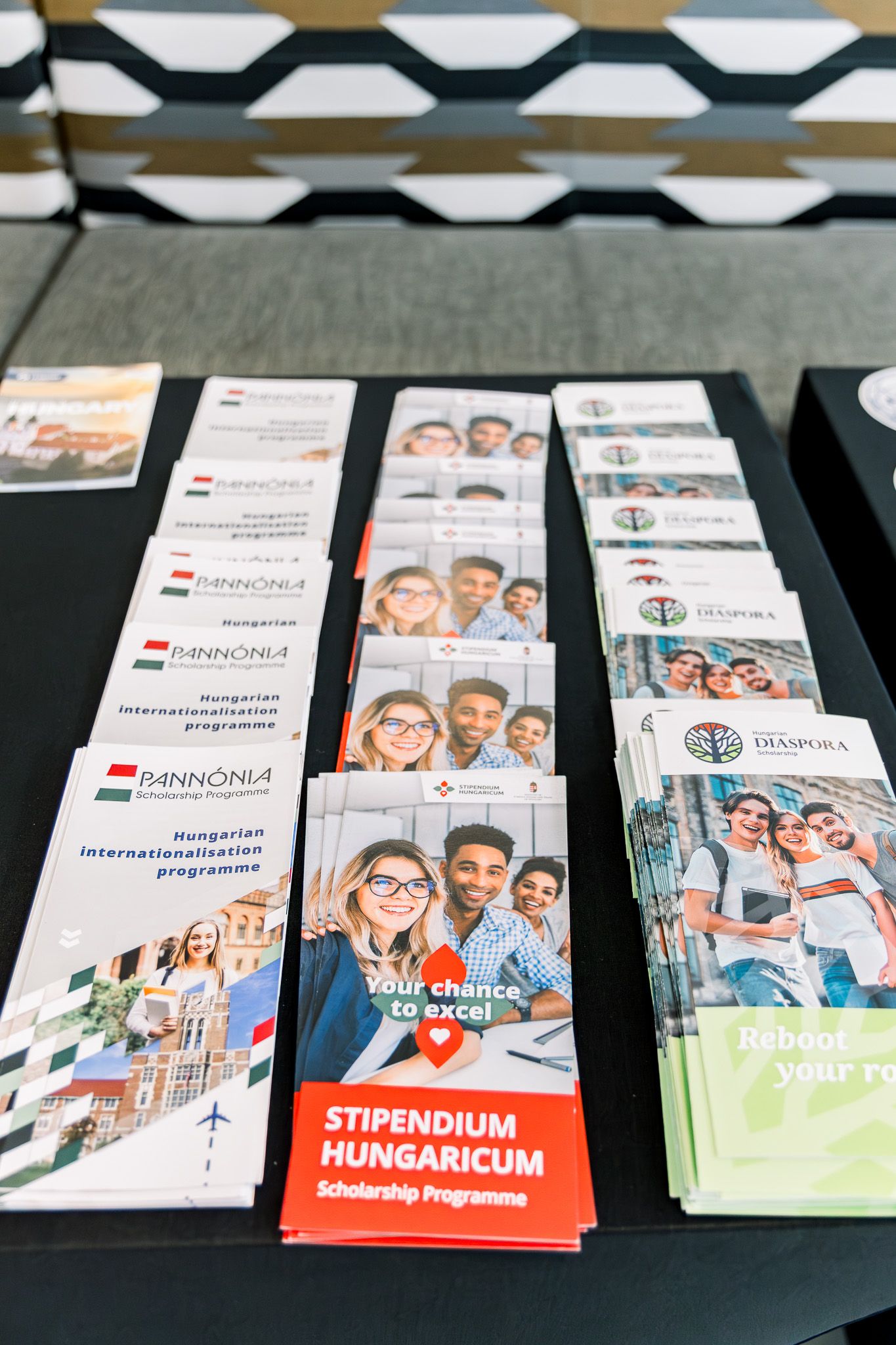 Stipendium Hungaricum scholarship brochures and Pannonia internationalization programme pamphlets displayed on a table.