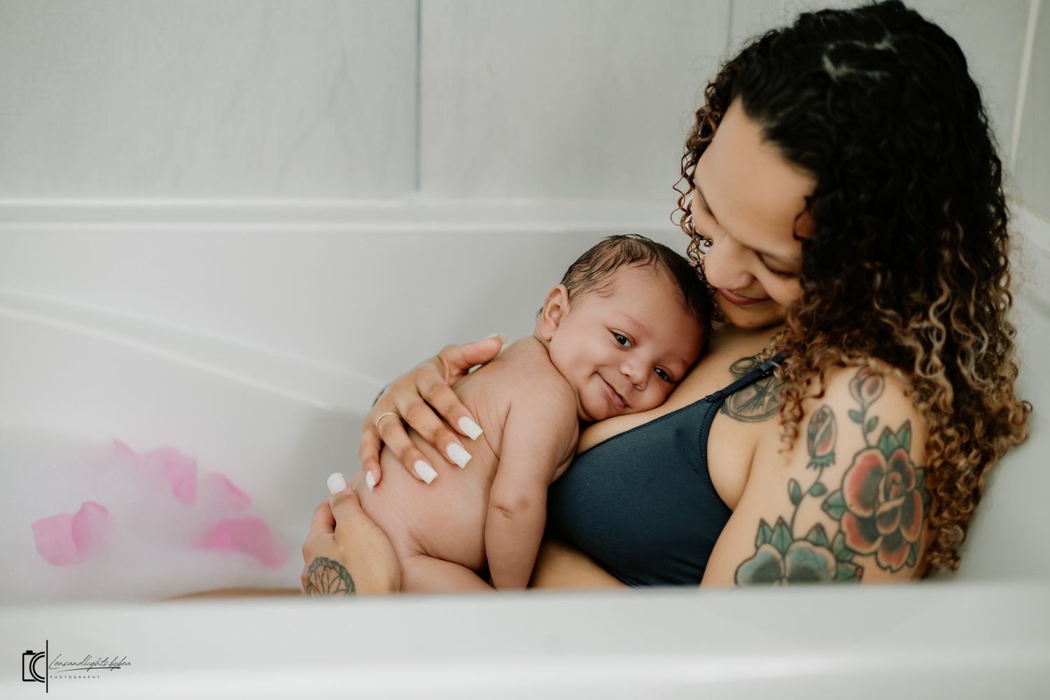 Intimate black and white photo series showing tender moments between parent and baby during a lifestyle photography session.