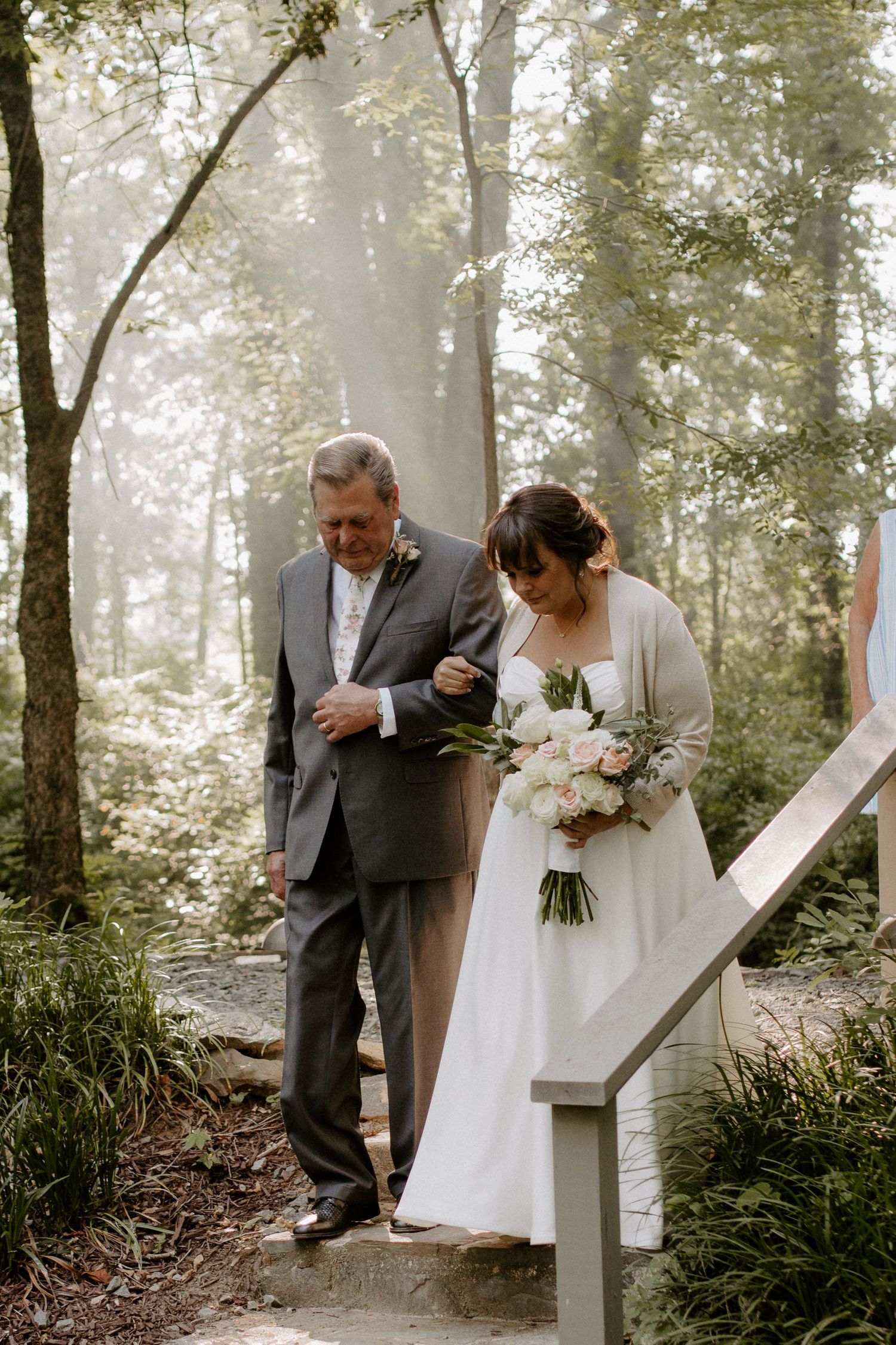 Father and bride sharing a tender moment before the ceremony