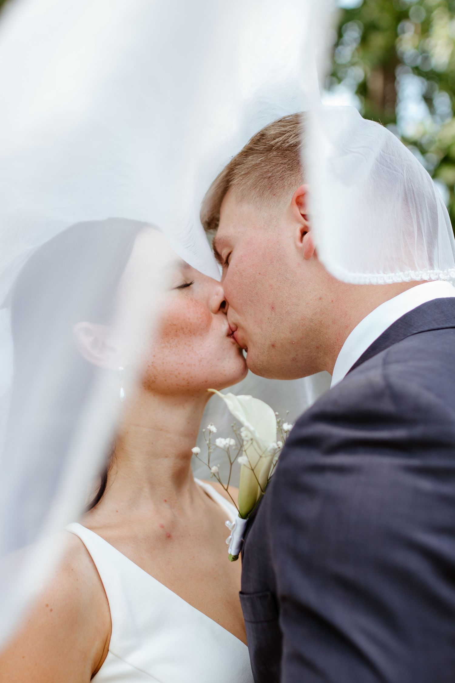 Bride and groom sharing a romantic moment during their wedding
