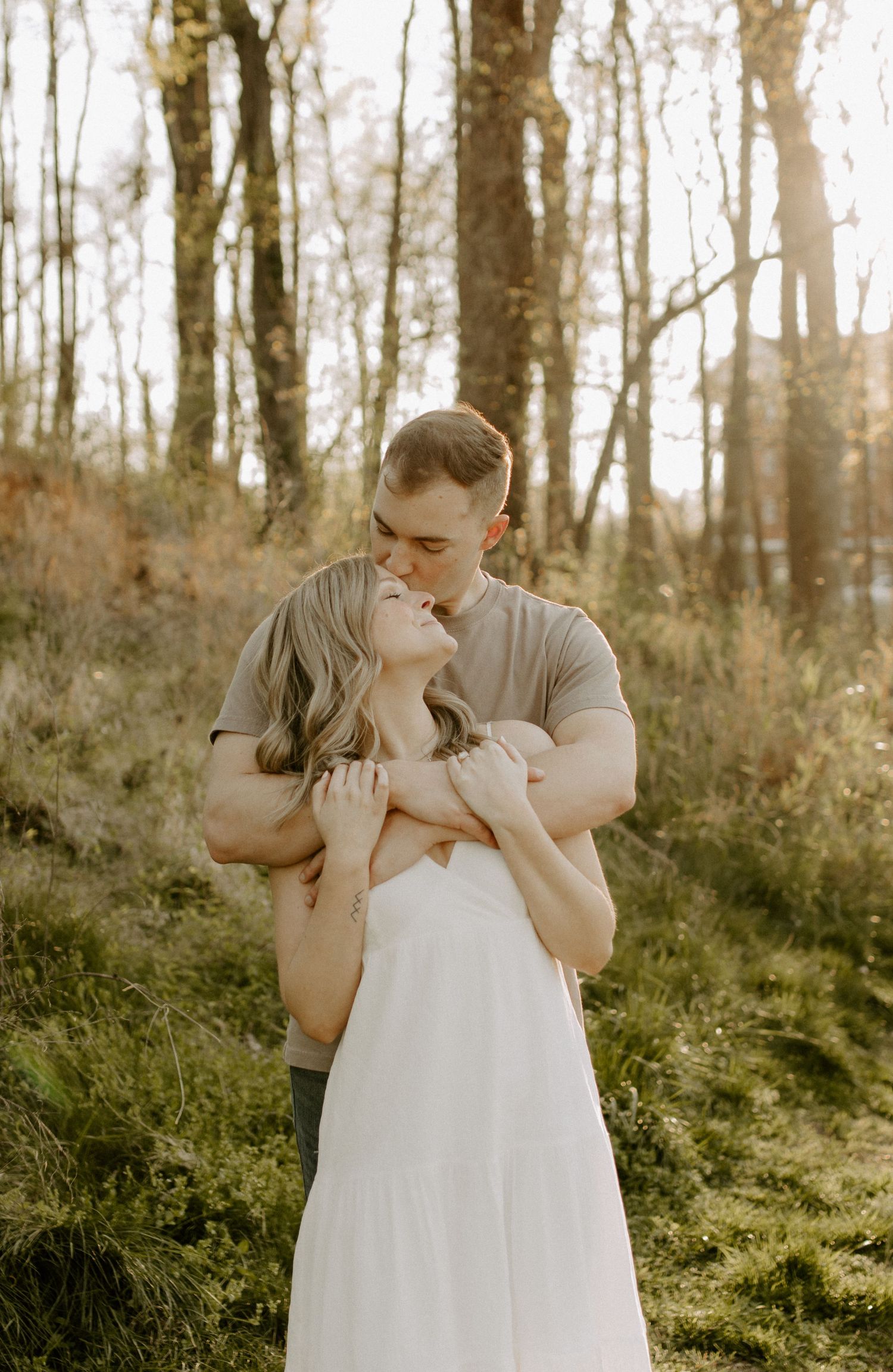 couple posing outdoors after getting engaged in rock hill sc
