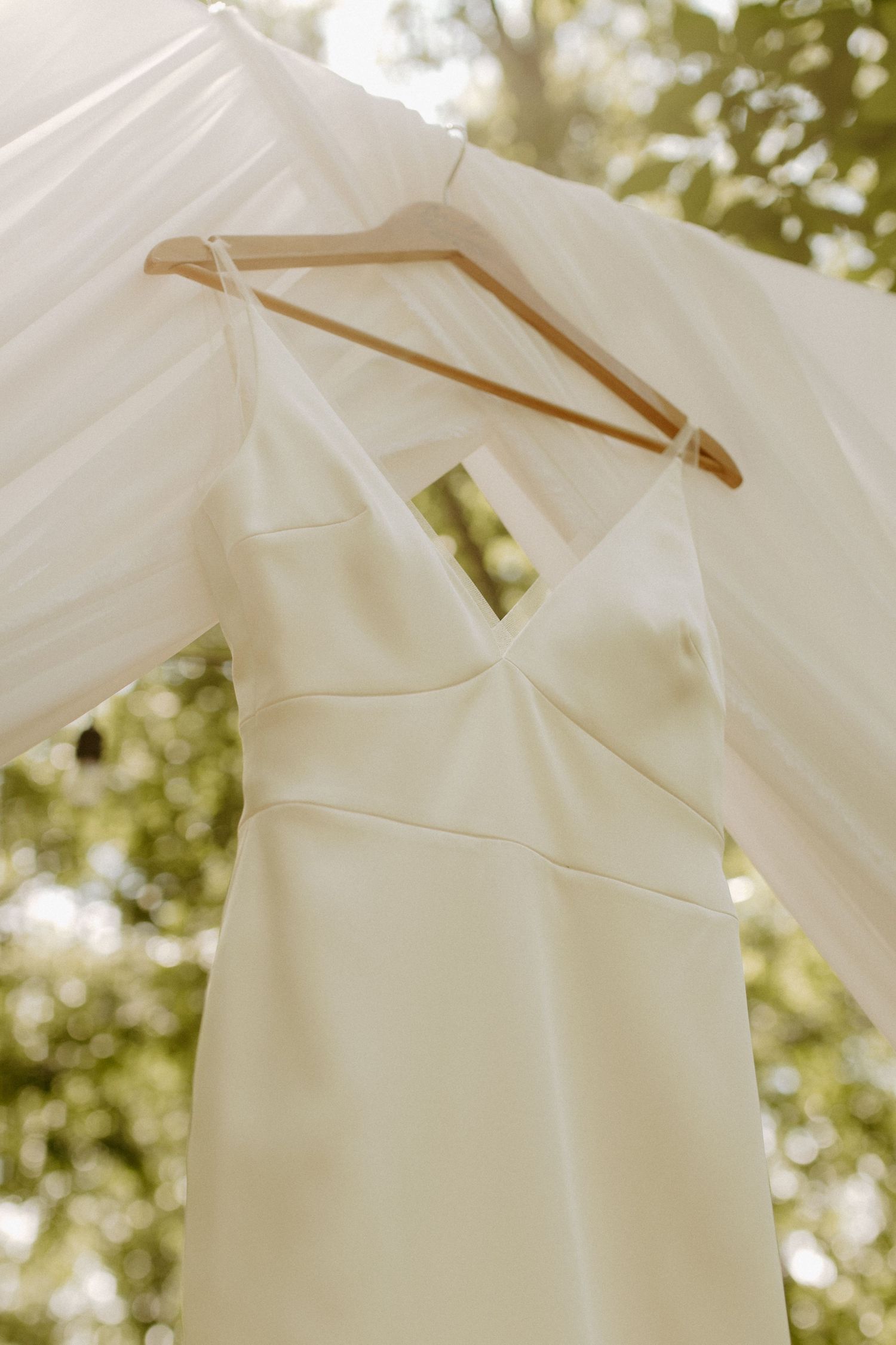 brides wedding dress hanging outside at venue in rock hill
