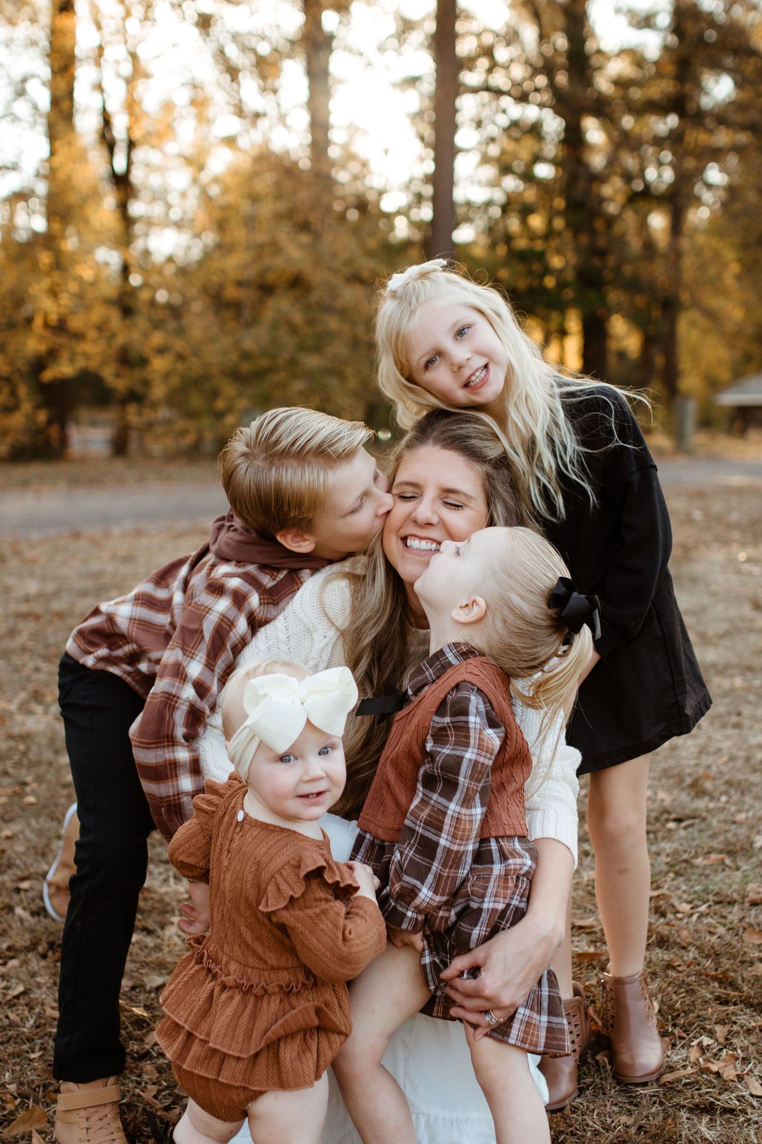 Children hugging their mom during a family photography session