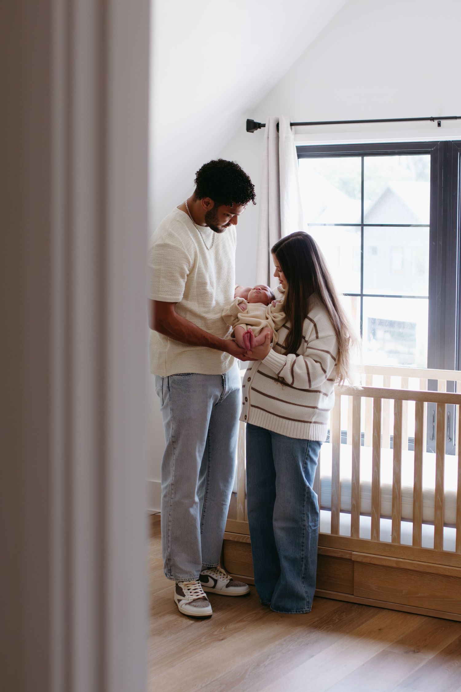 Parents holding their newborn baby