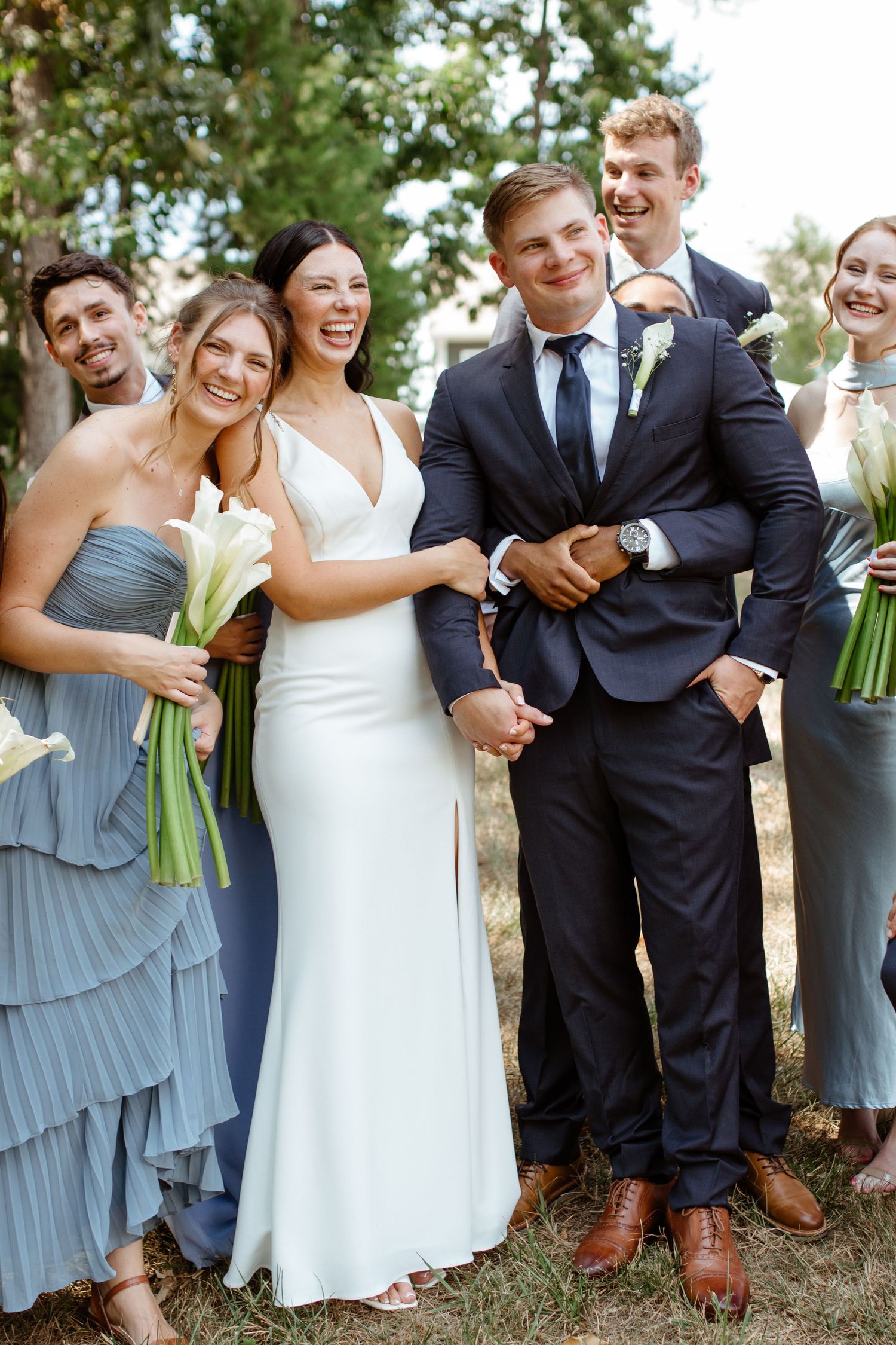 bride and groom with bridal party outside in Charlotte backyard wedding