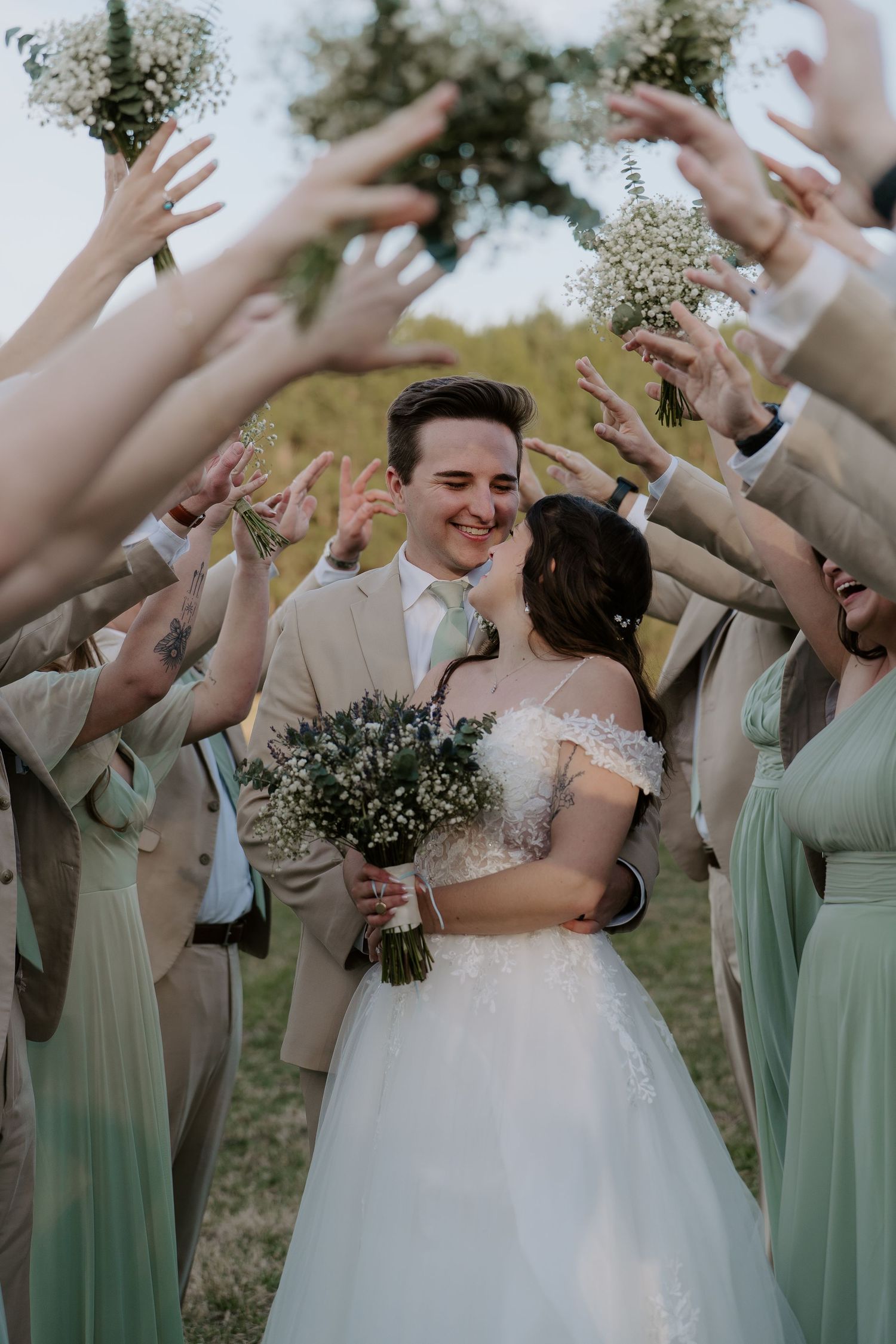 A bride and groom smiling together.