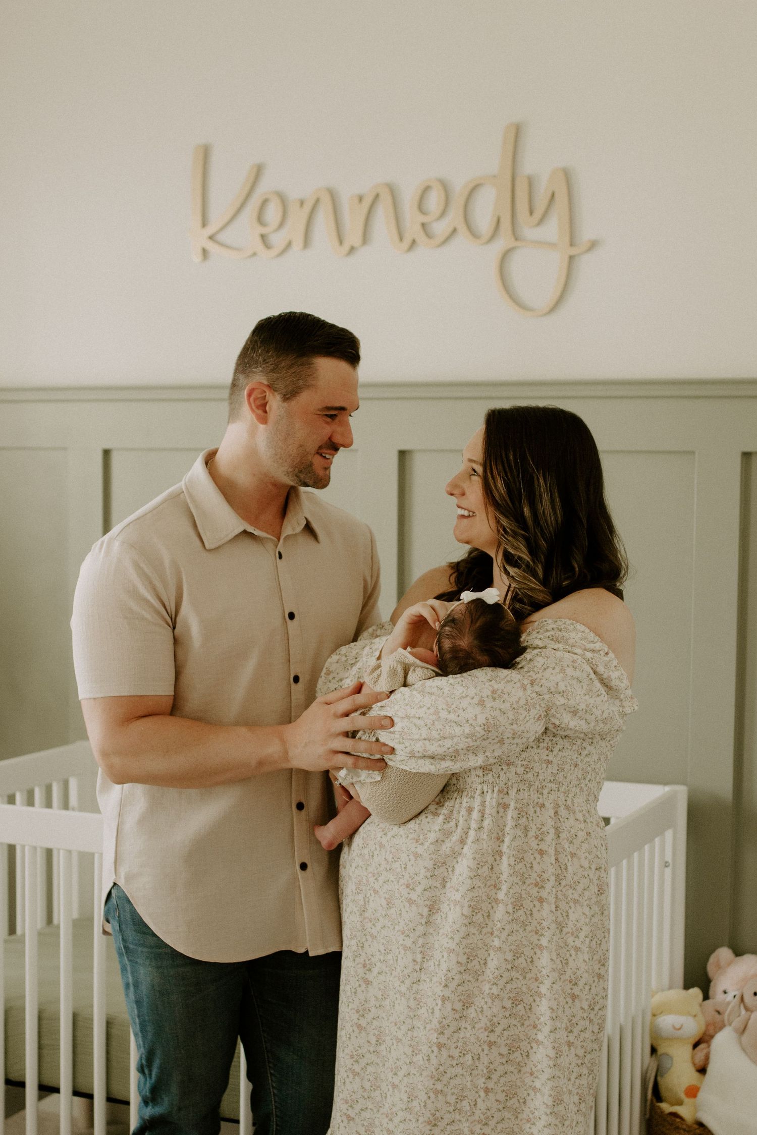 New parents embracing their baby during quiet moment