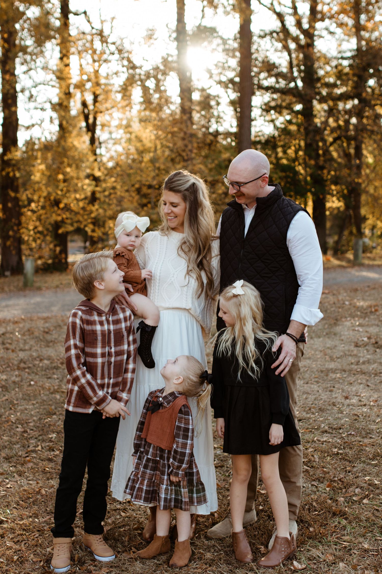 Family smiling together during an outdoor photography session in rock hill