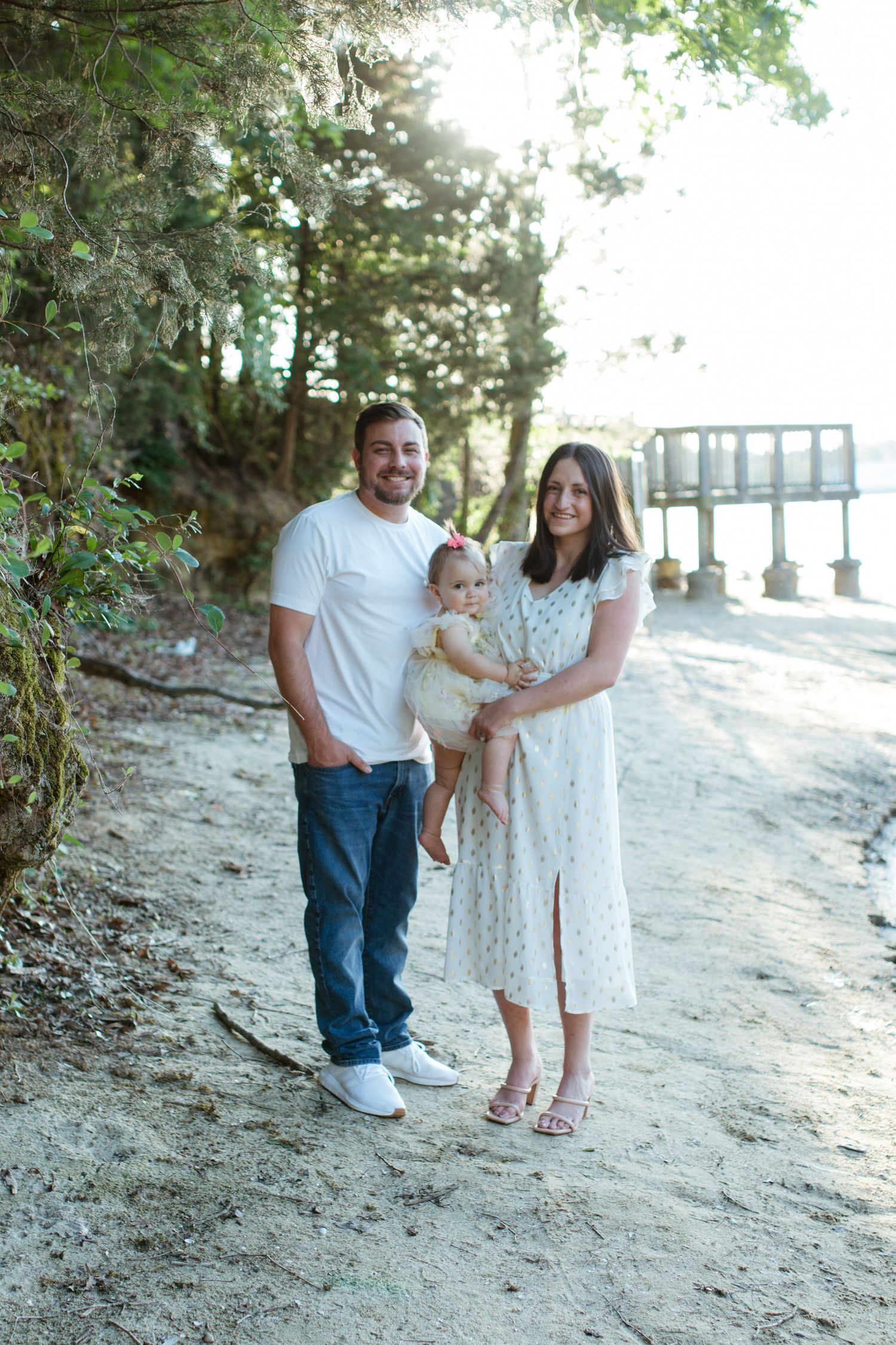 family posing together on lake wylie during a charlotte nc family photoshoot
