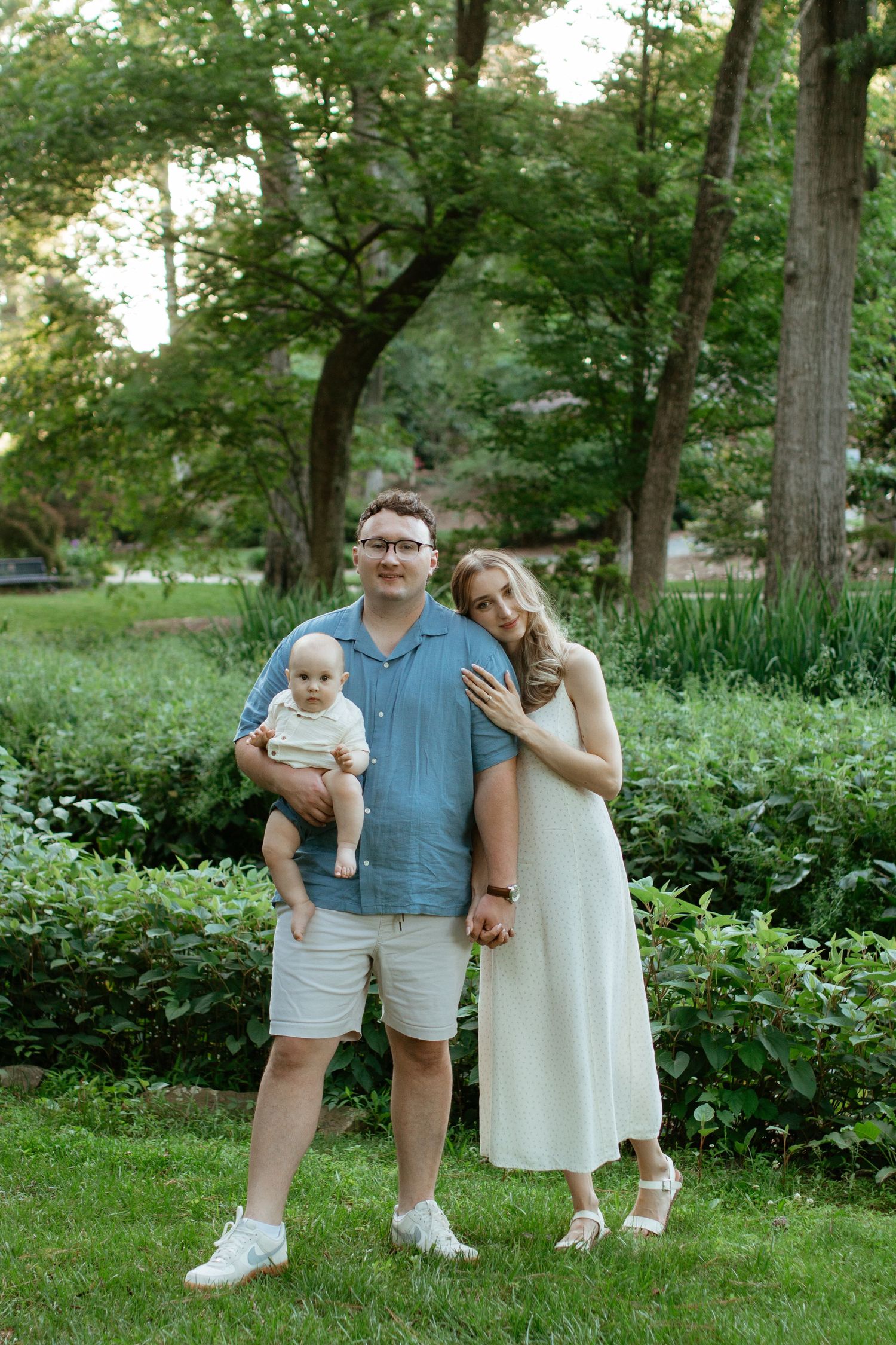 Family smiling together during an outdoor photography session in rock hill