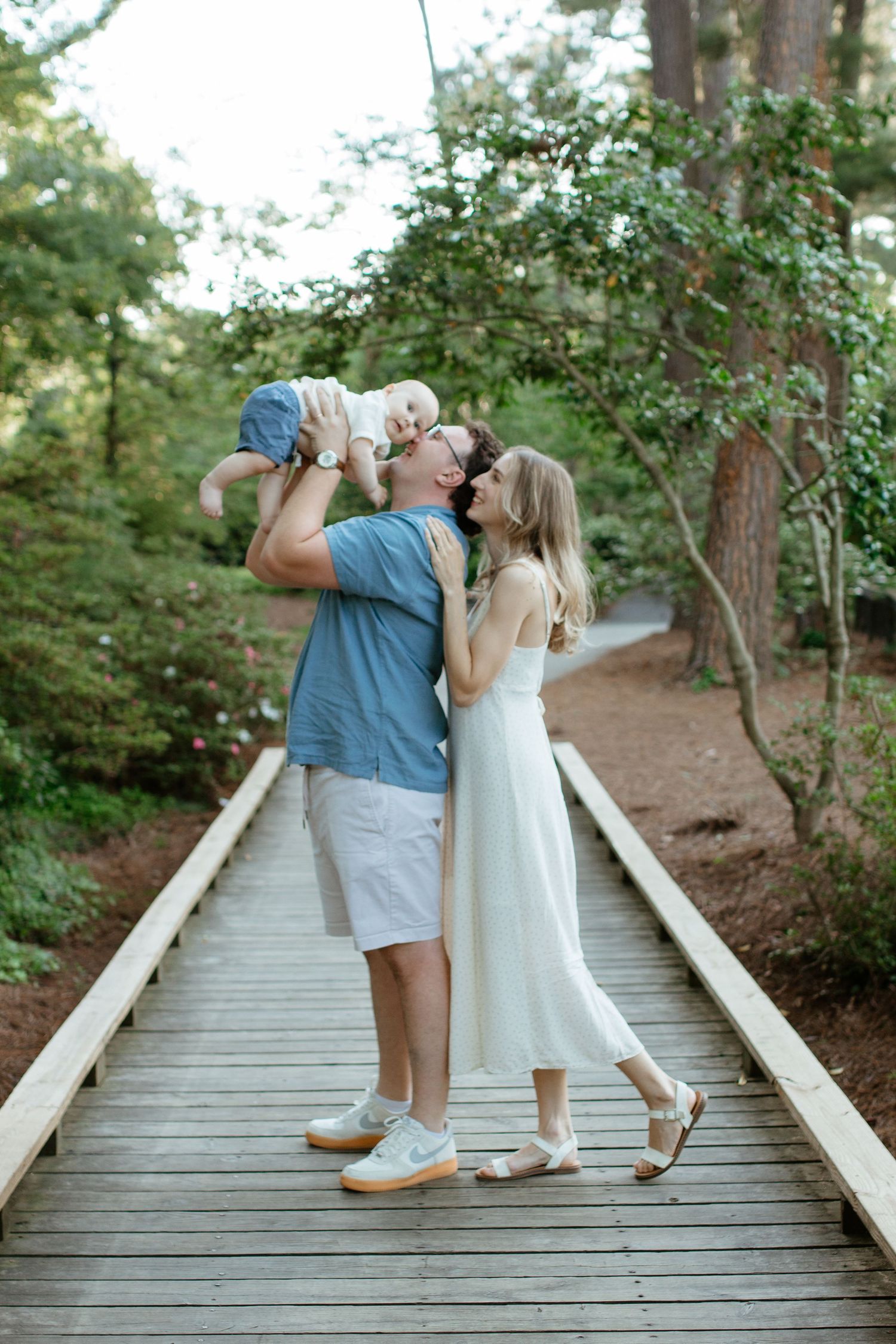Family smiling together during an outdoor photography session