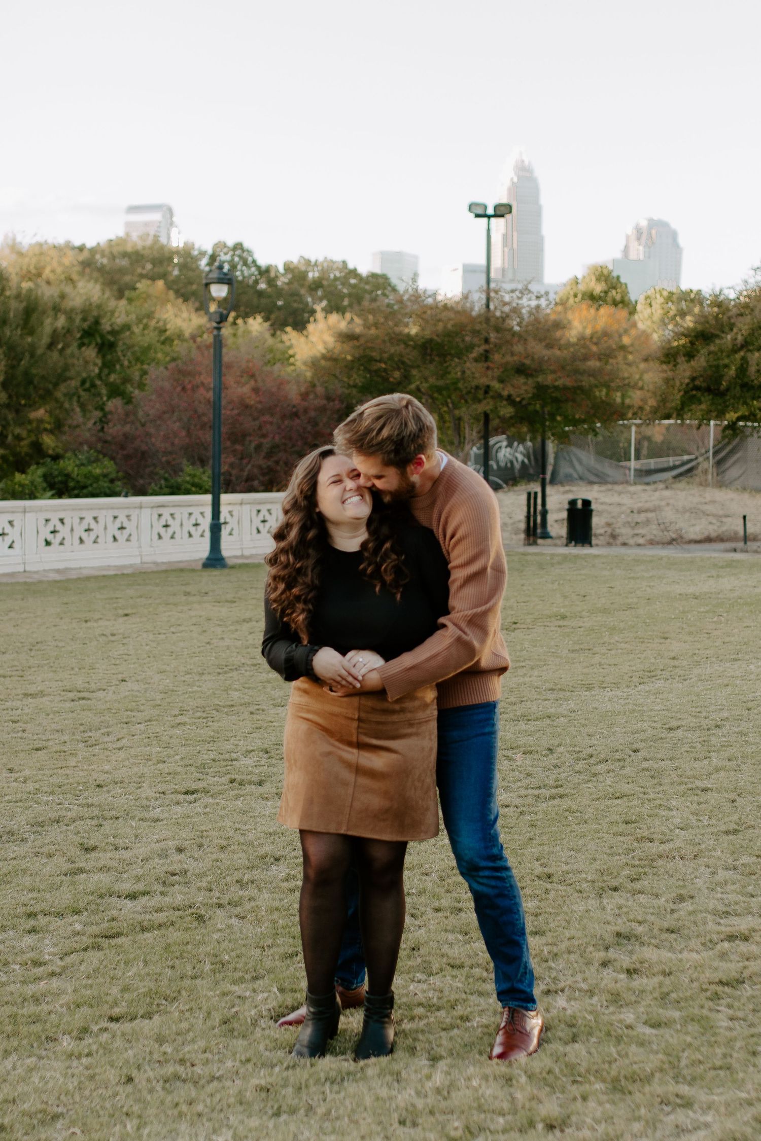 couple hugging each other during a romantic charlotte engagement session