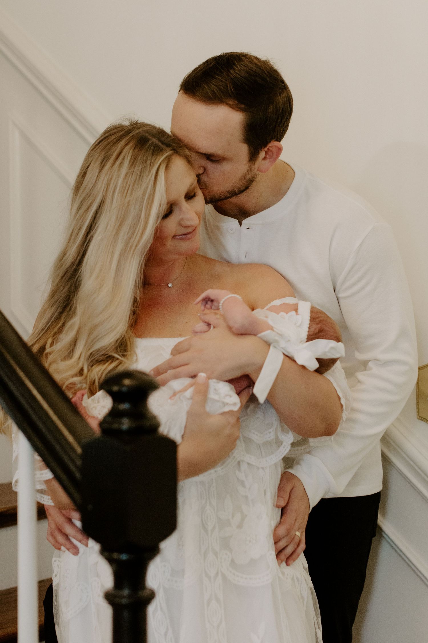 Family holding newborn in soft natural light Rock Hill South Carolina