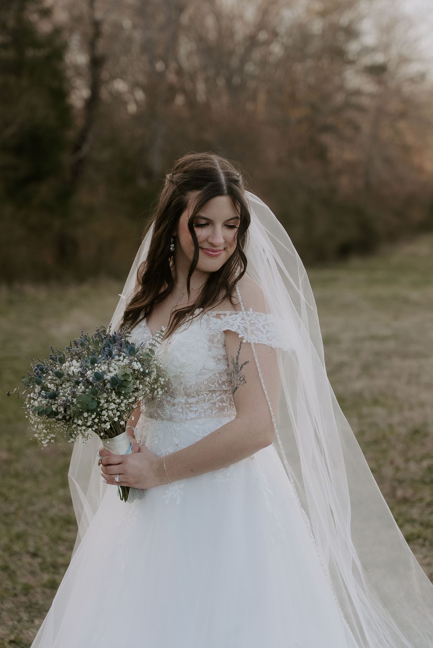 Beautiful bride in her wedding dress outdoors