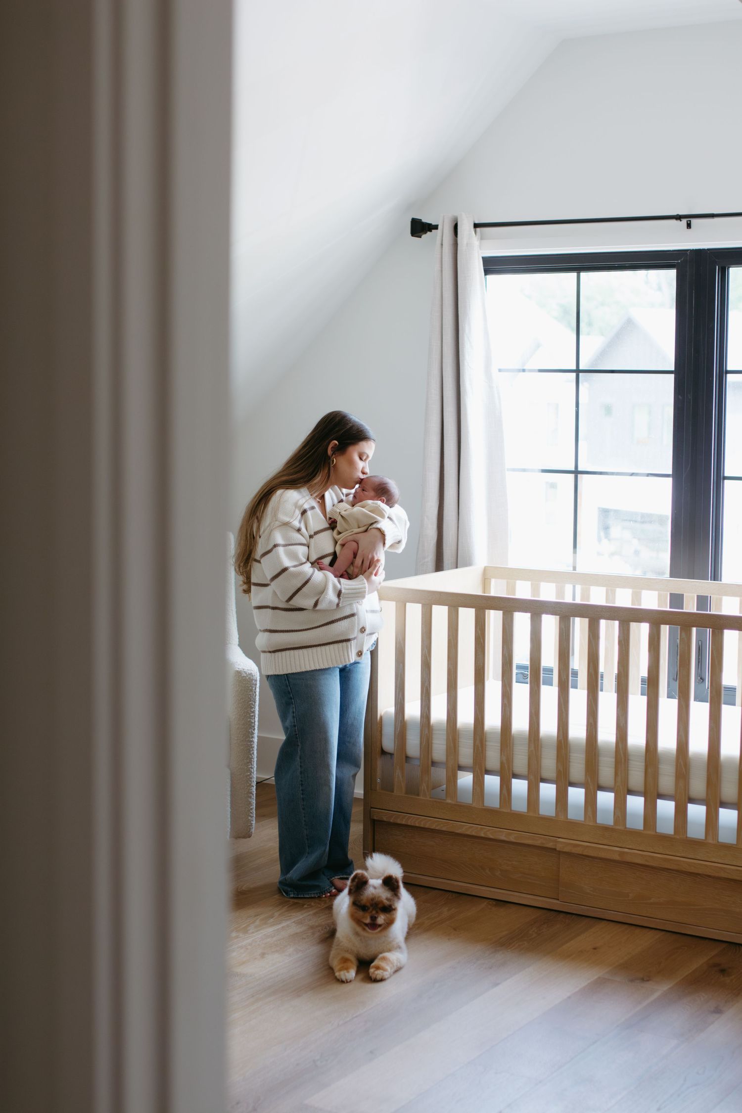 Mother and baby sharing a sweet, candid moment during a rock hill newborn session