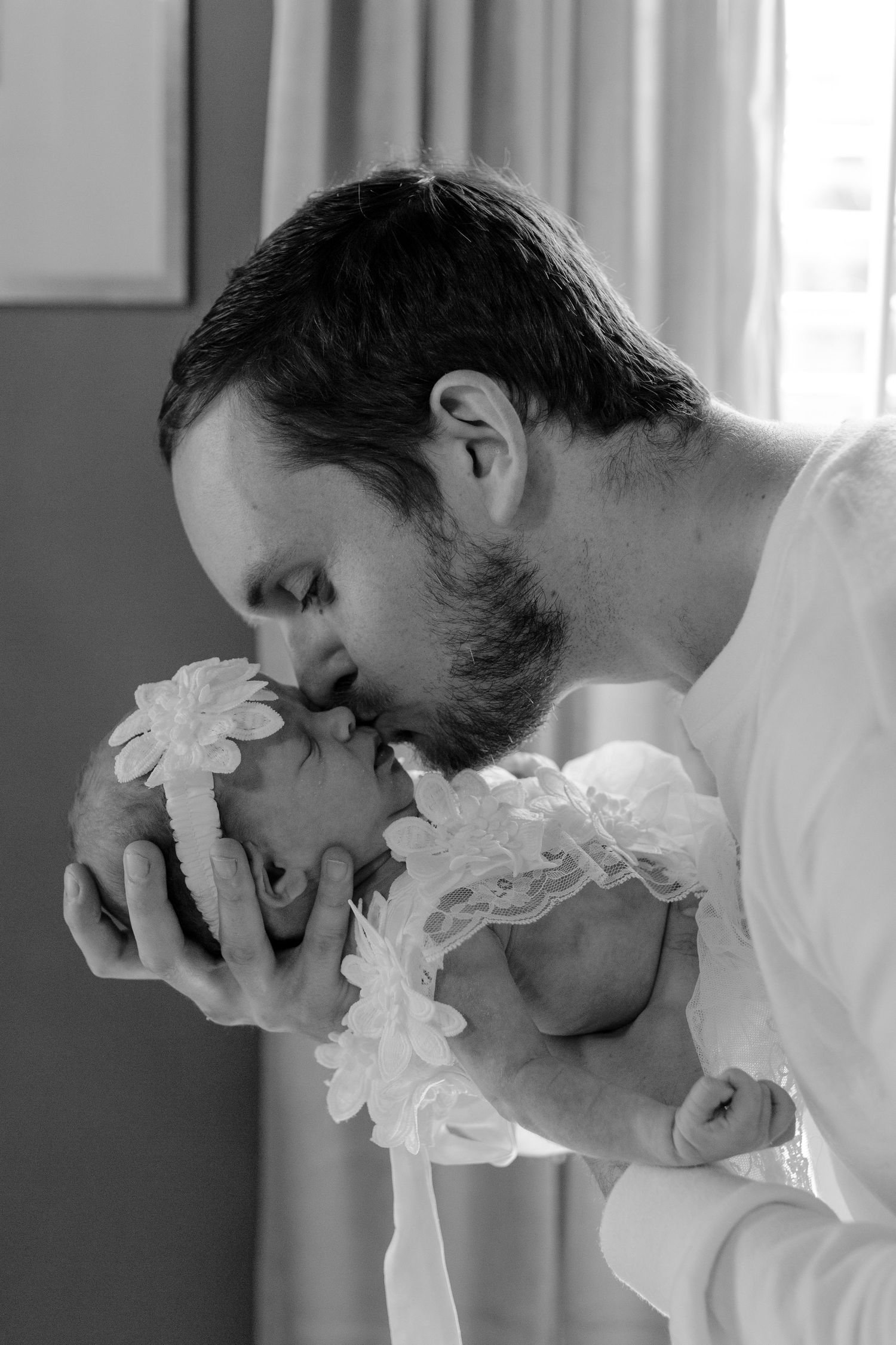 Father holding his newborn baby in a tender embrace