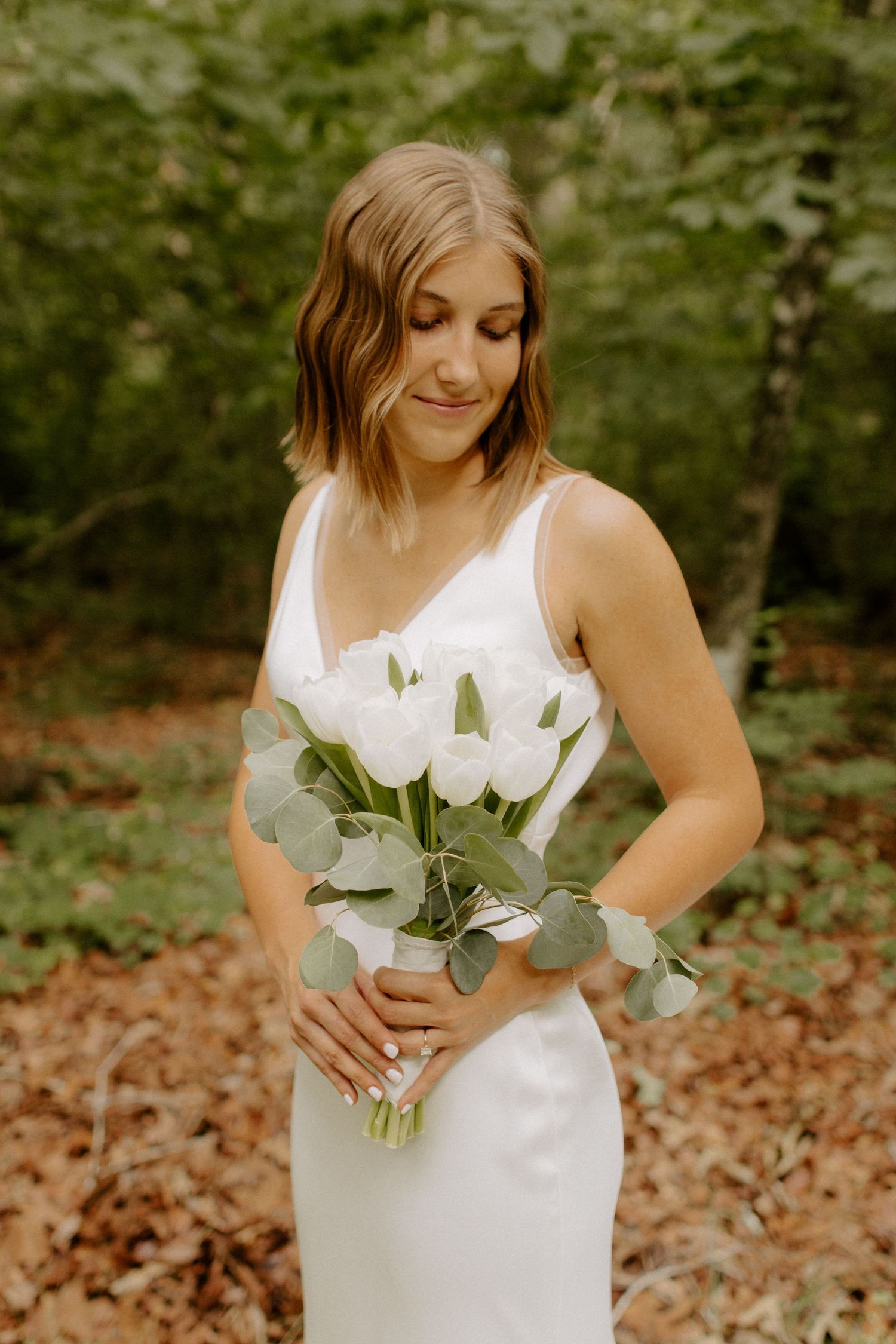Beautiful bride in her wedding dress outdoors