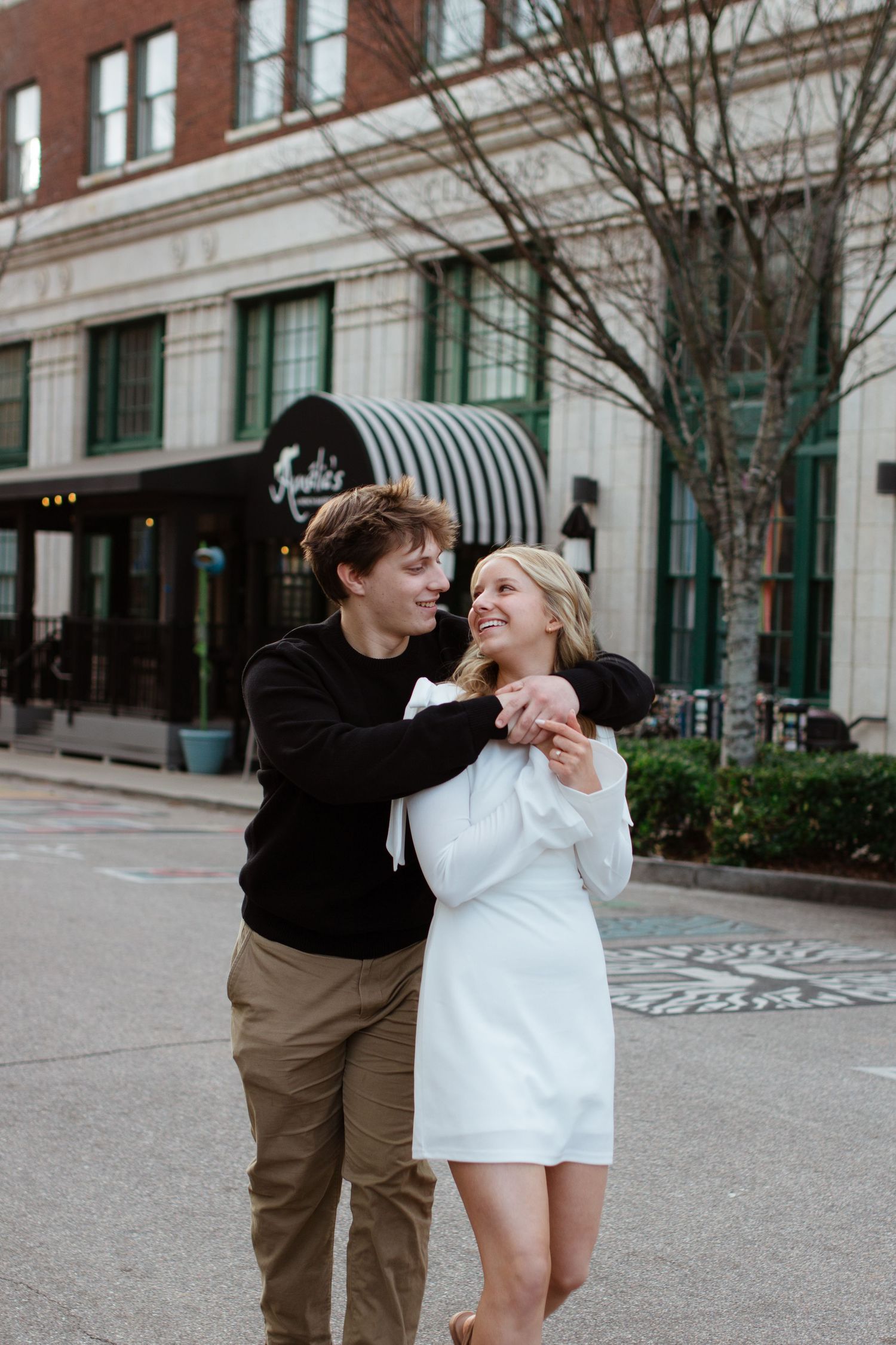 An eloping couple celebrating.