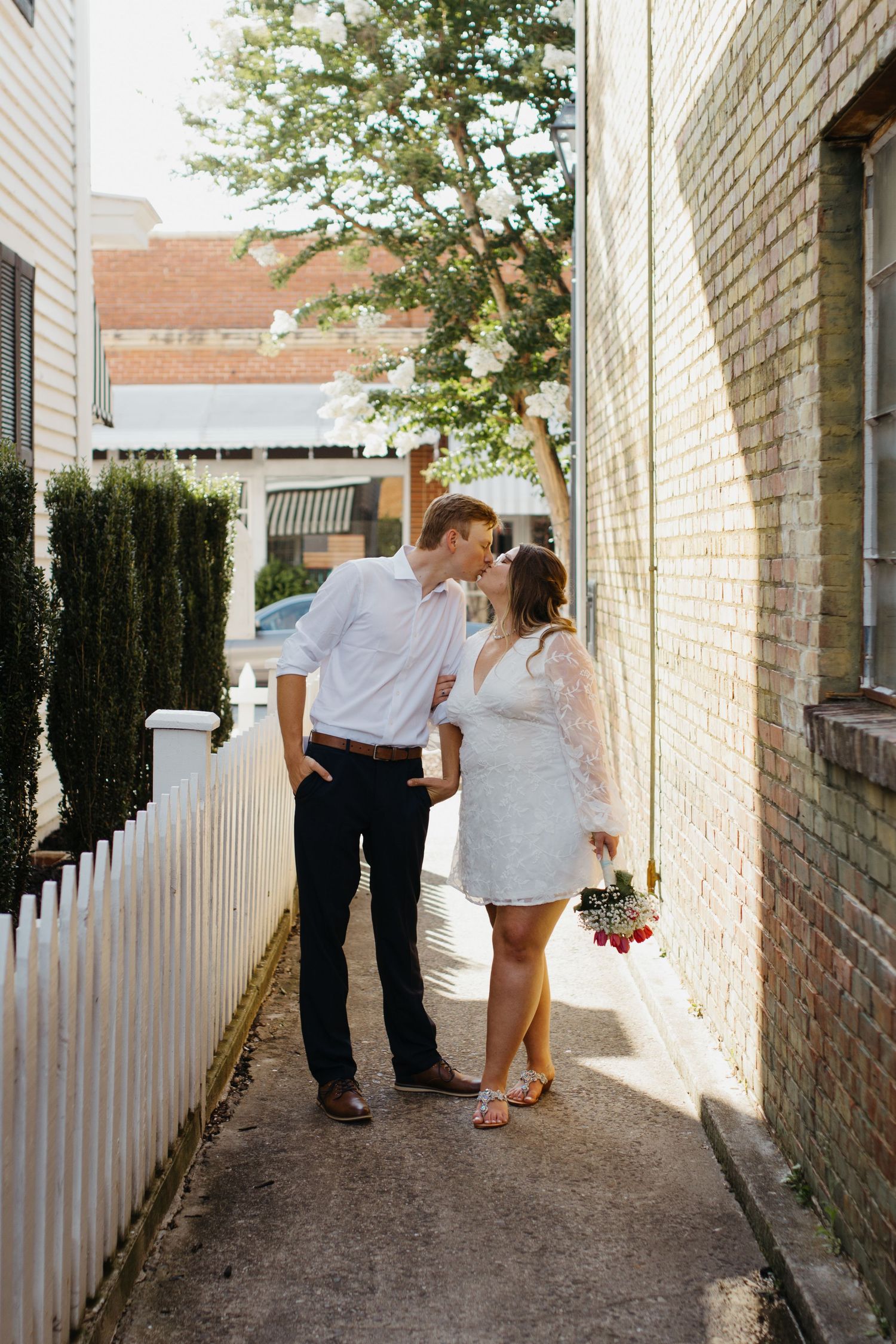 Bride and groom sharing a romantic moment during their wedding in downtown york south carolina