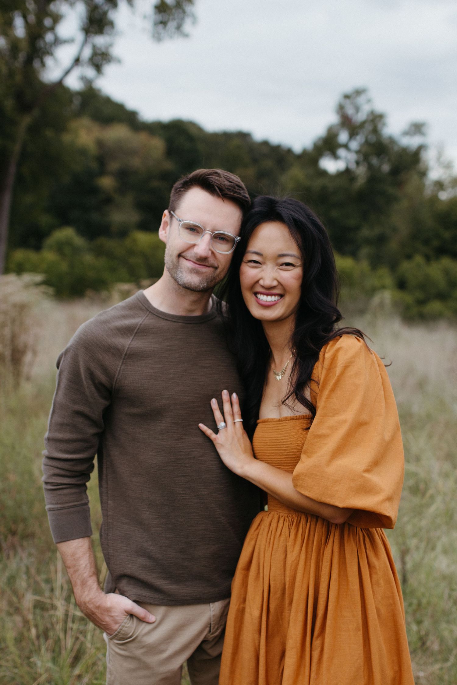 couple posing outside in a field in rock hill