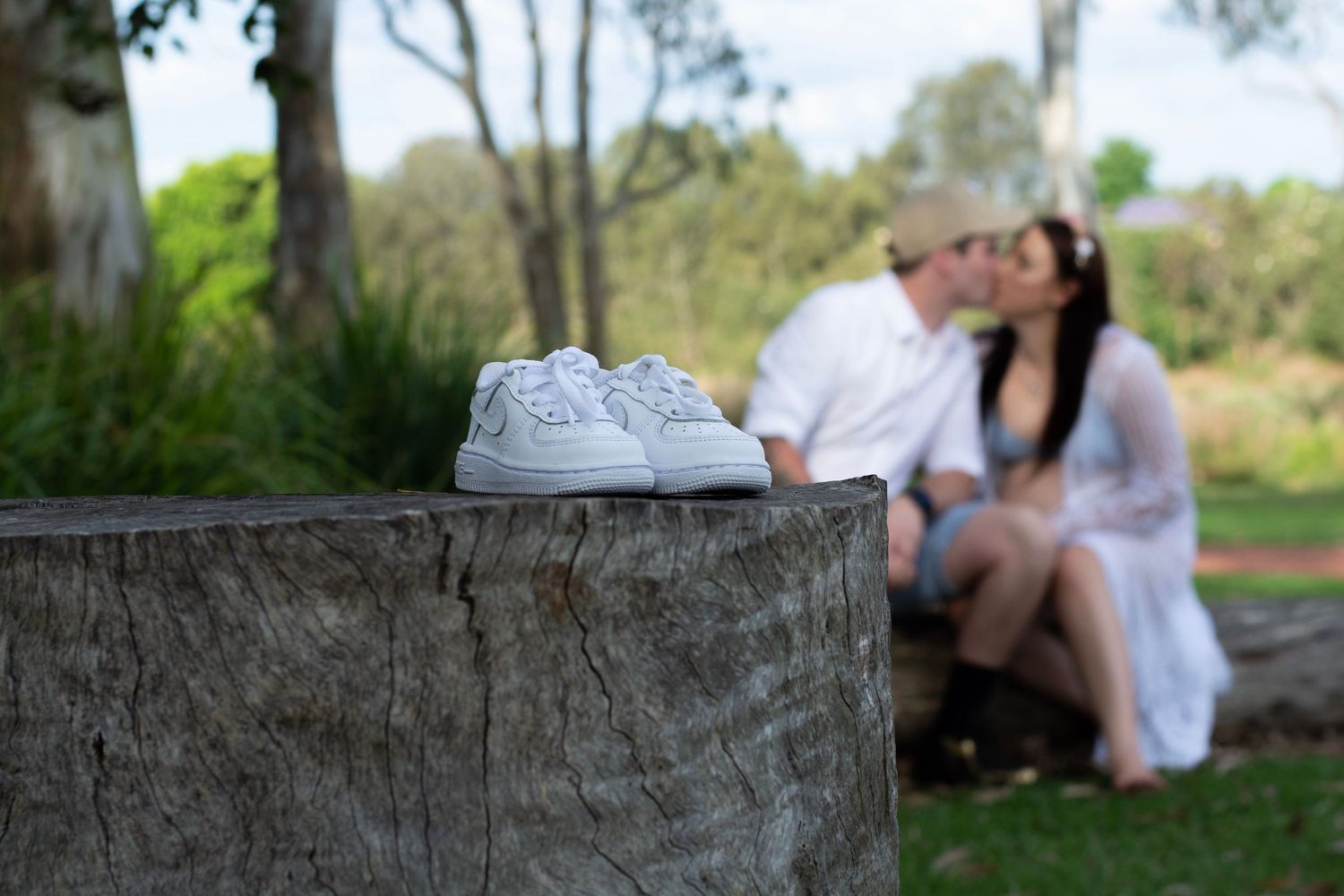 Maternity photo with little shoes
