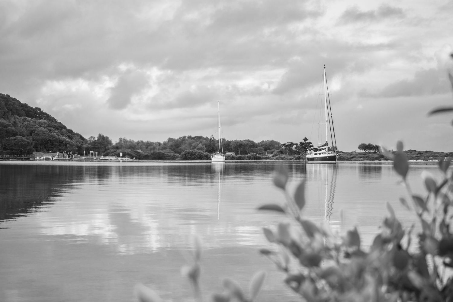Black and white Yacht on calm water