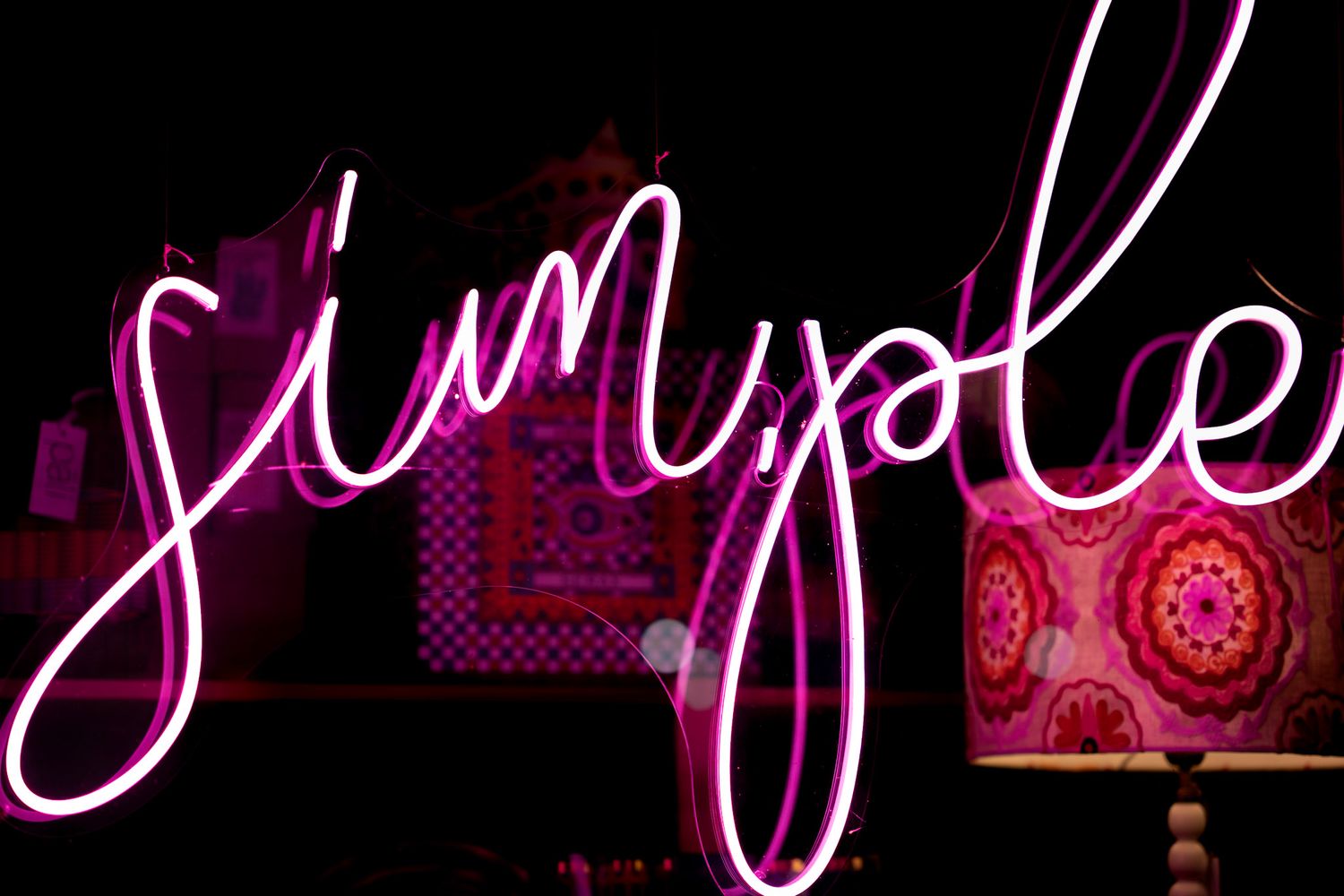 Neon simple sign in shop window at night