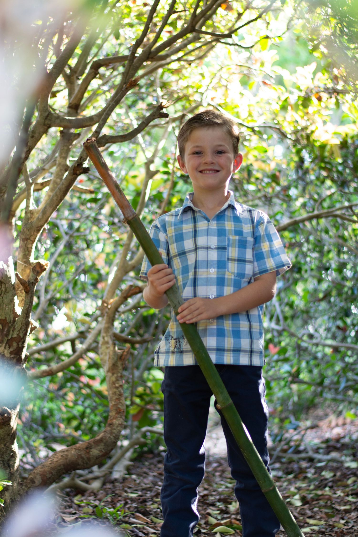 Boy playing with stick