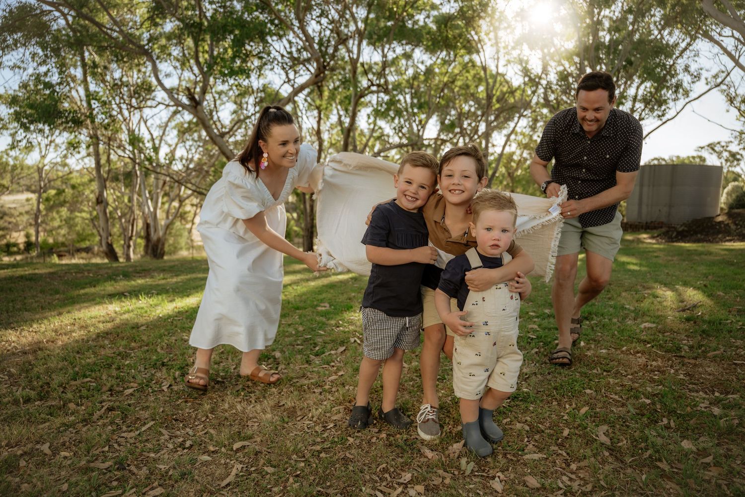 Young family walking in garden