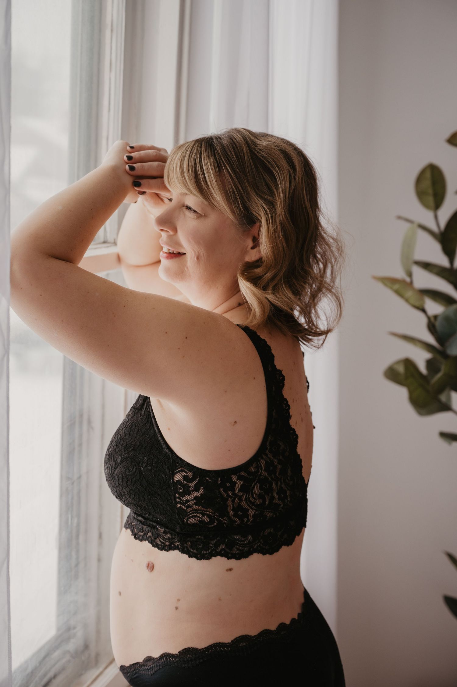 Woman posing during boudoir session