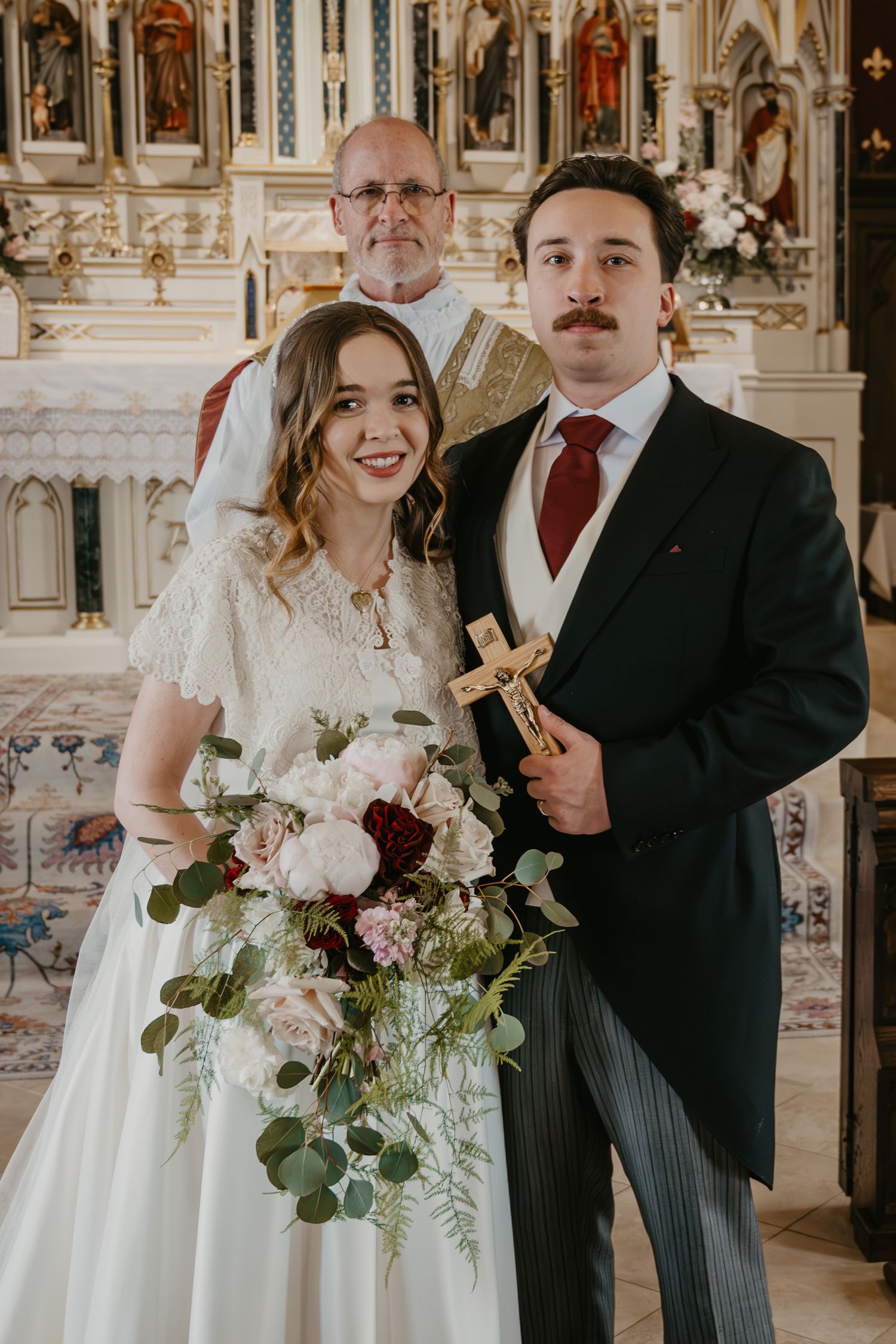 catholic bride and groom portrait in church
