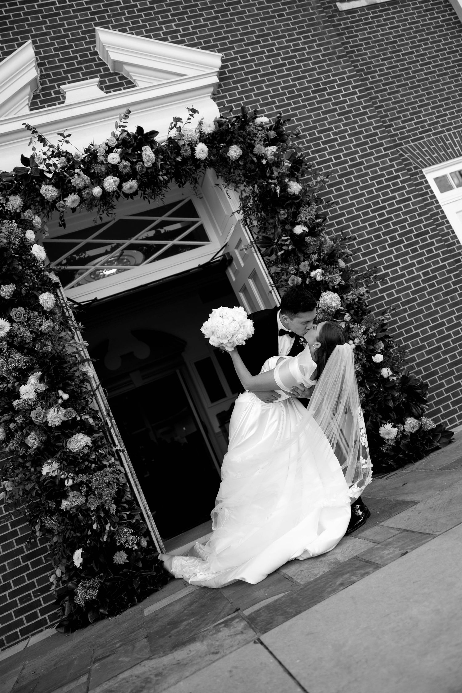 A sequence of black and white photos showing a bride in a flowing white gown sitting on church steps with roses.