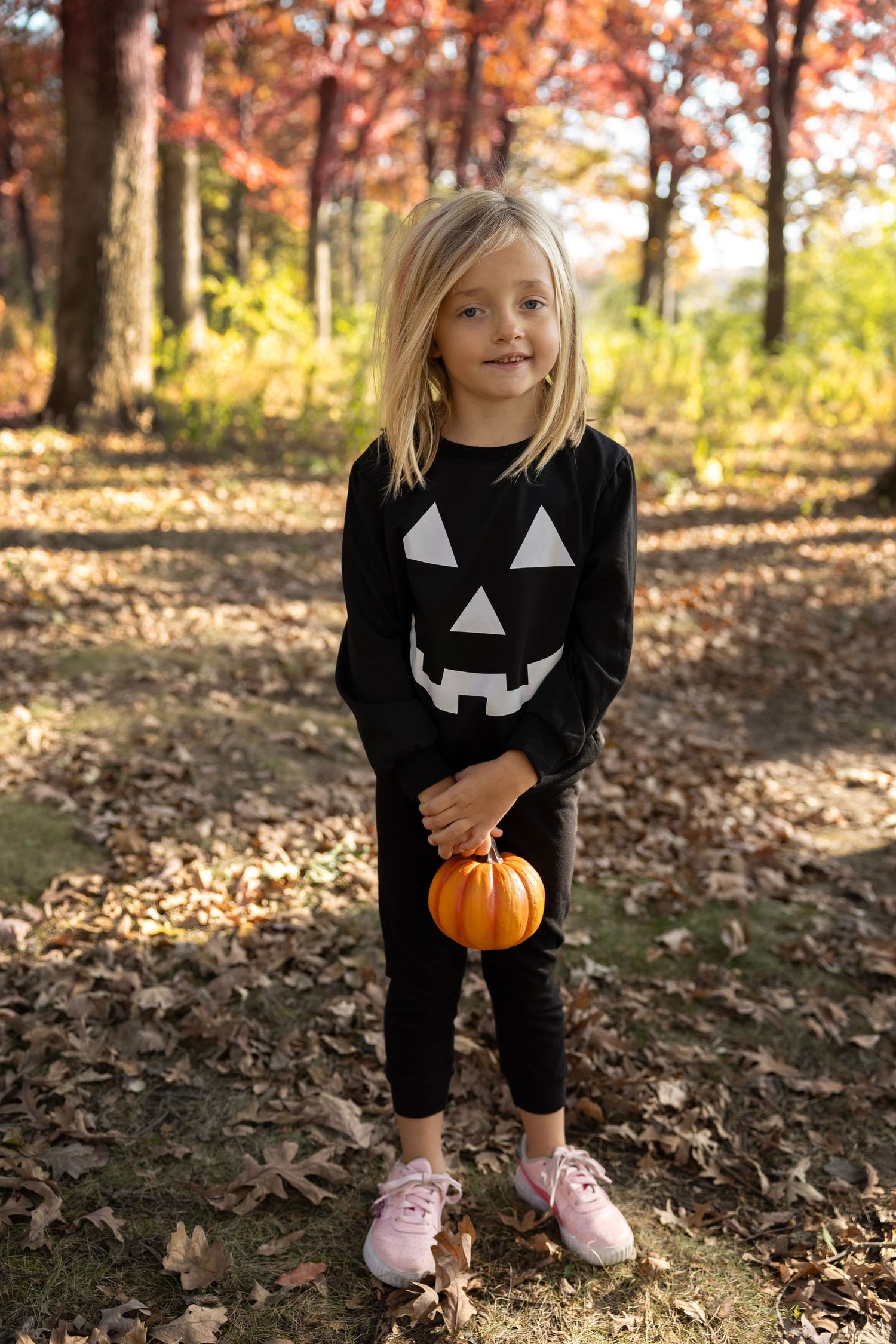 Creative Halloween-themed photoshoot featuring a child in a spooky costume, captured during a specialty photography sess