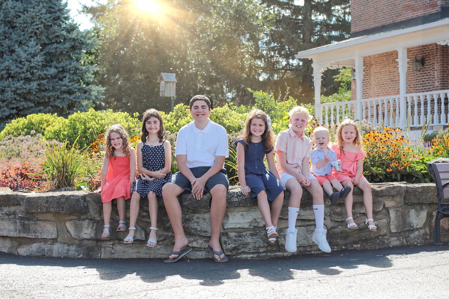 Group photo of kids captured in St. Charles, IL at Peck Farm, featuring happy children enjoying a playful outdoor settin