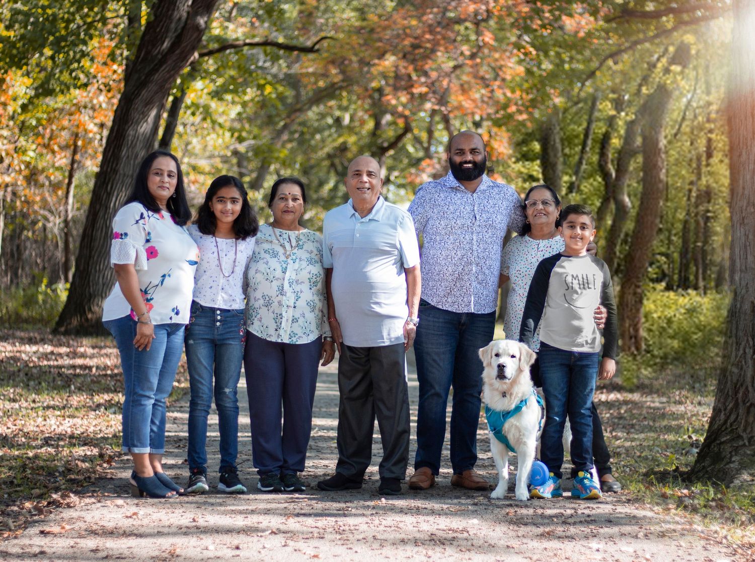 A heartfelt generational photo featuring grandparents surrounded by their children and grandchildren, capturing the love