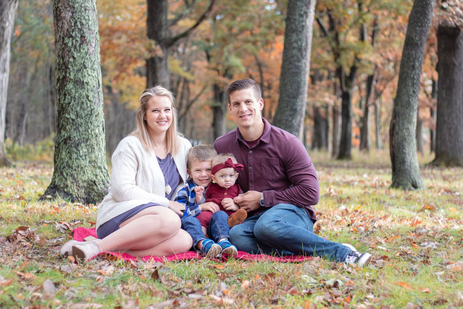 A heartwarming photoshoot of a small, growing family in Elgin, Illinois, enjoying the outdoors, surrounded by natural be