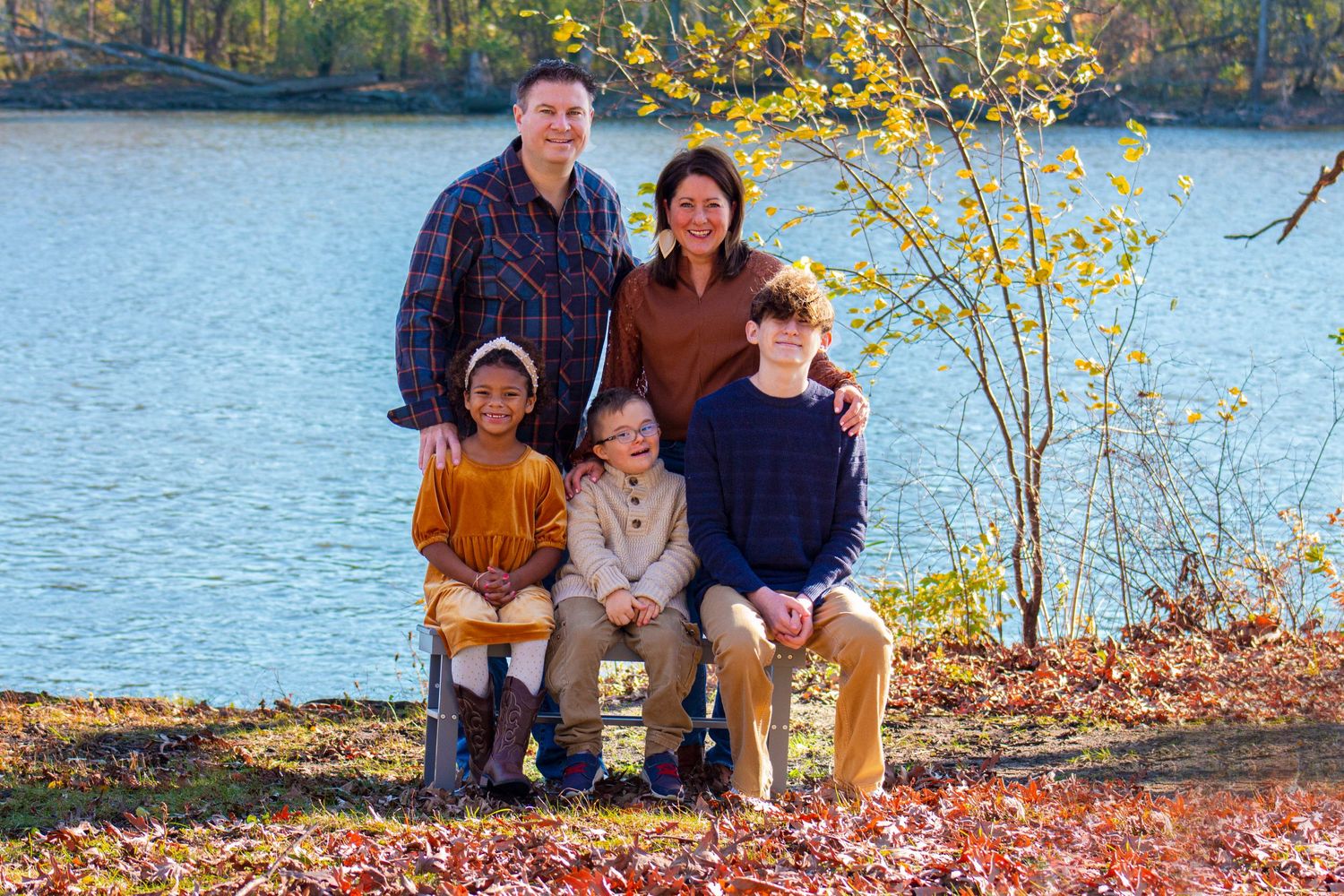 Small family photoshoot with children captured during golden hour along the Fox River in South Elgin, IL, featuring warm