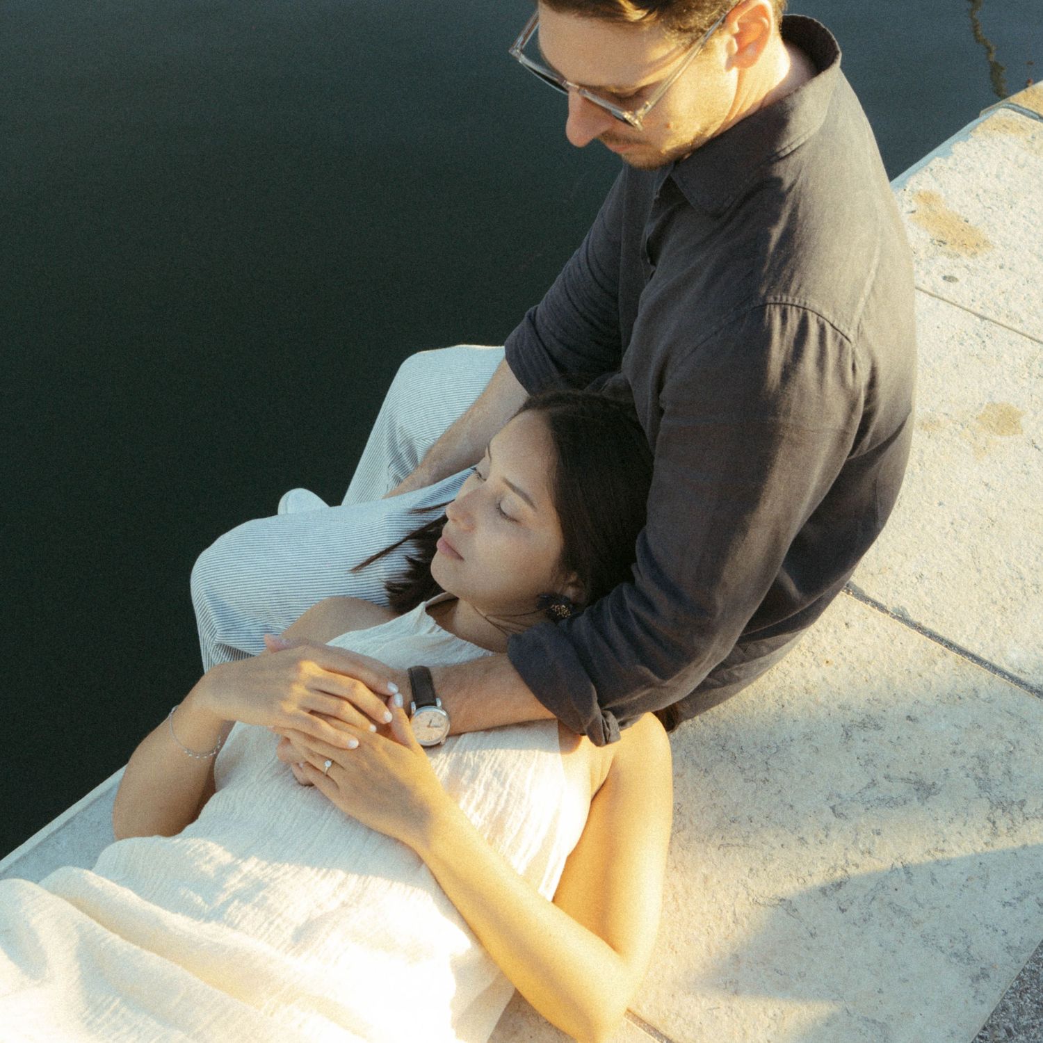 Medical professional demonstrates proper CPR chest compression technique on a training mannequin in a clinical setting.