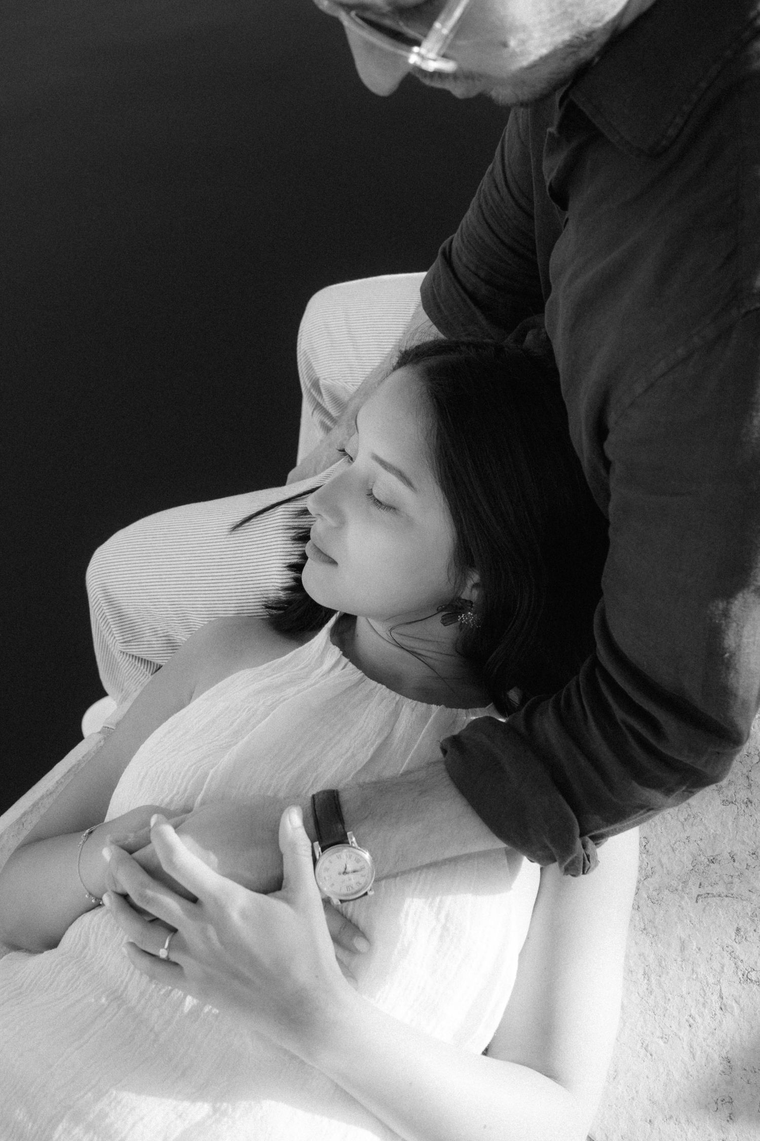 A romantic black and white photo sequence showing a couple kissing in intimate close-up shots.