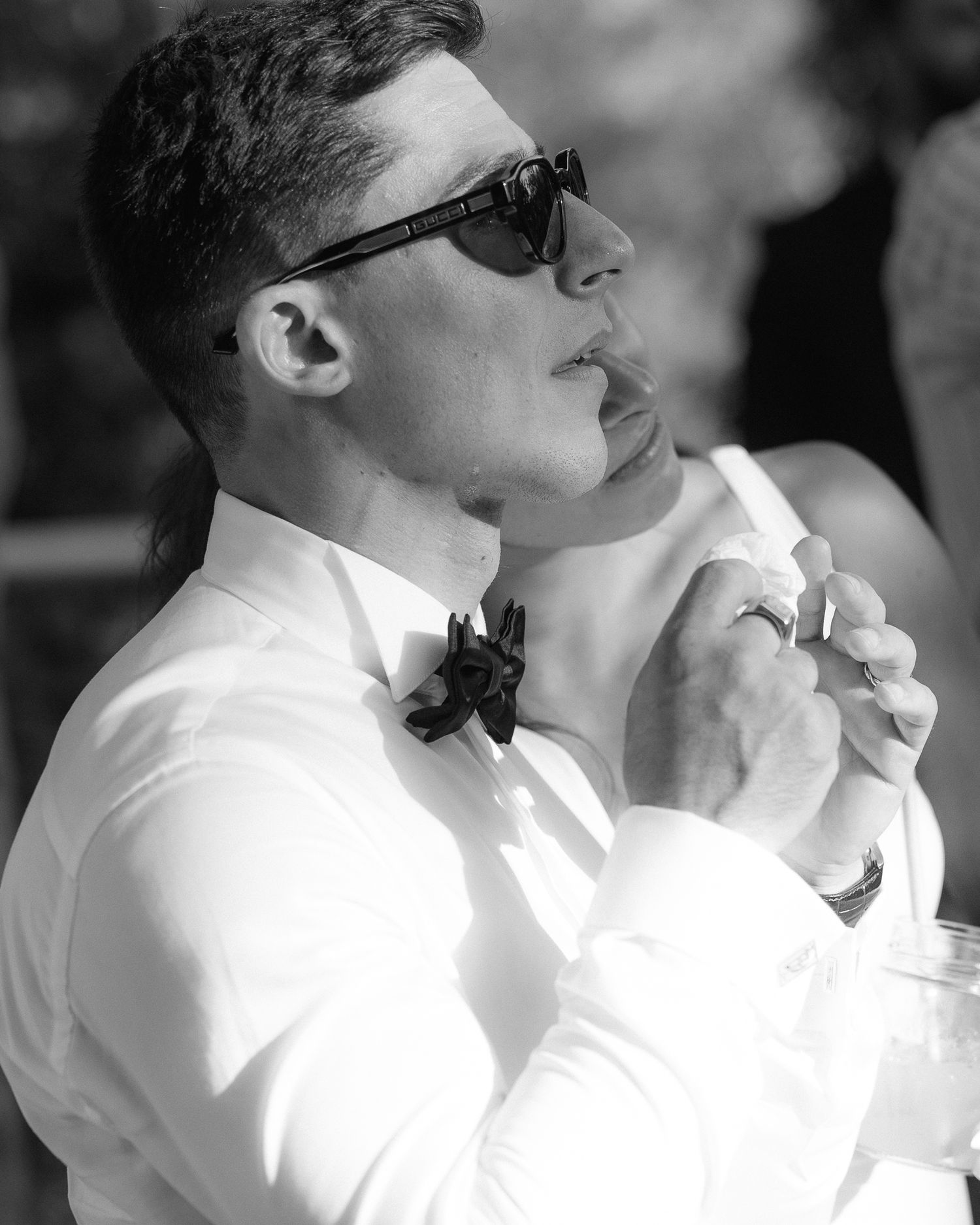 A black and white photo sequence shows a person in a white shirt and glasses smoking a cigarette.