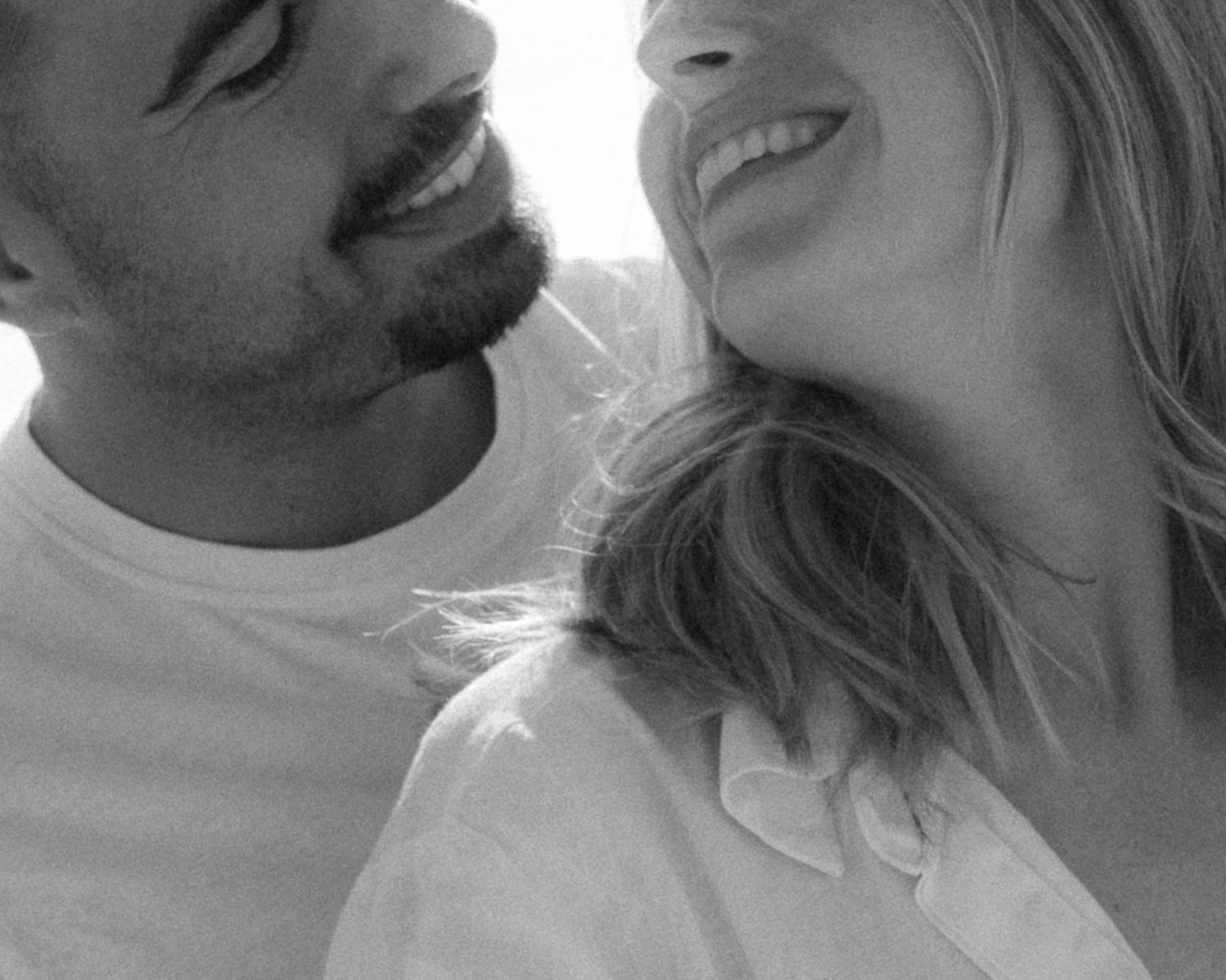 A series of black and white close-up profile shots showing intimate moments and expressions.