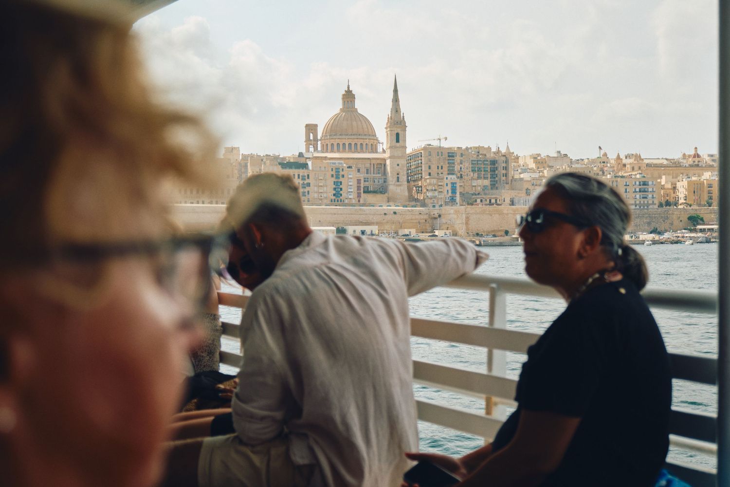 Historic Valletta skyline and St. Paul's Cathedral seen from harbor viewpoint in Malta.