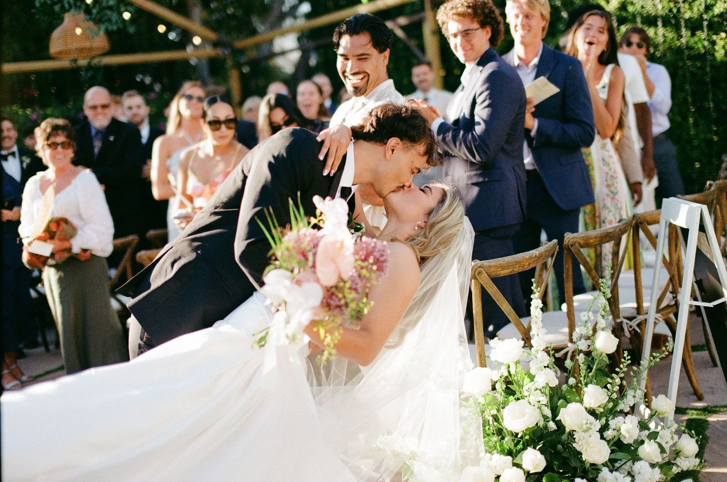 A bride and groom kiss on 35mm film in Santa Barbara