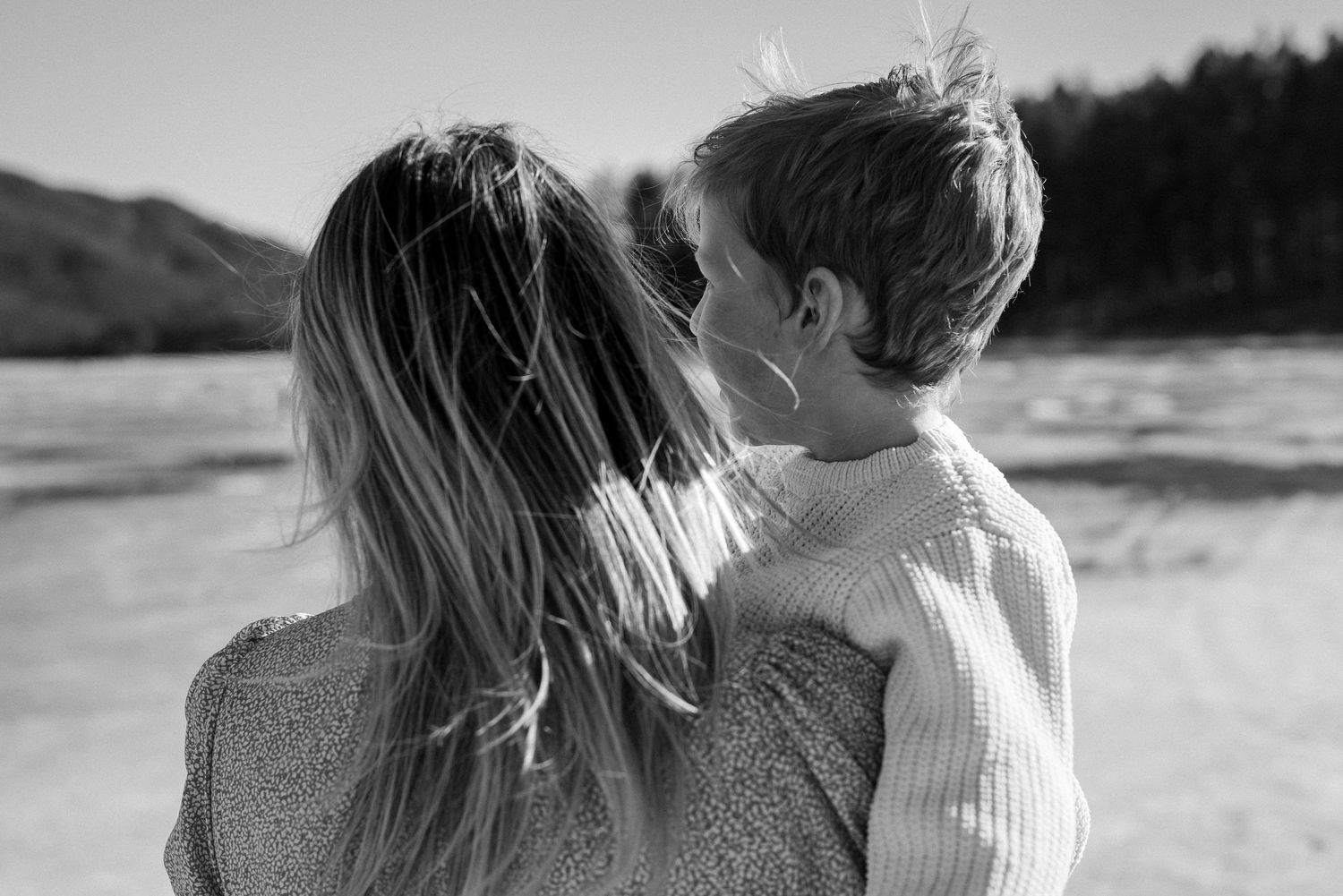 A mom and son look at the lake