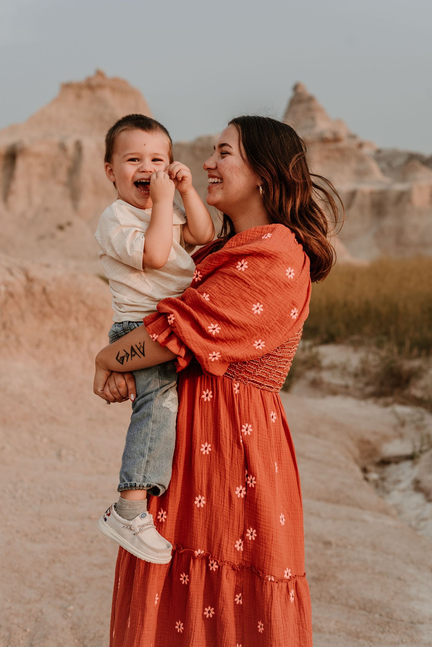 A series of candid moments between family members in a rustic outdoor setting with orange tones.