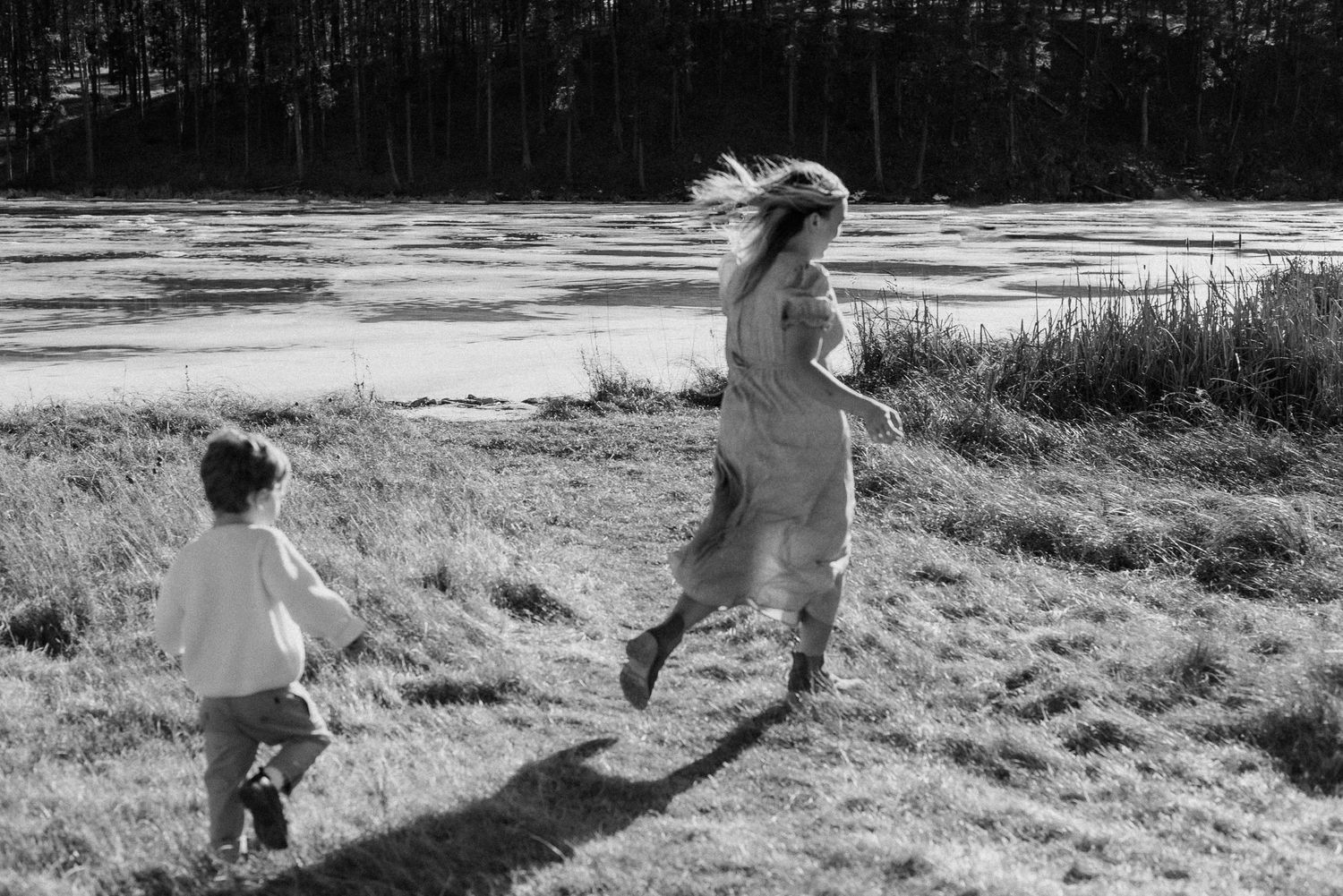 A mom and son running